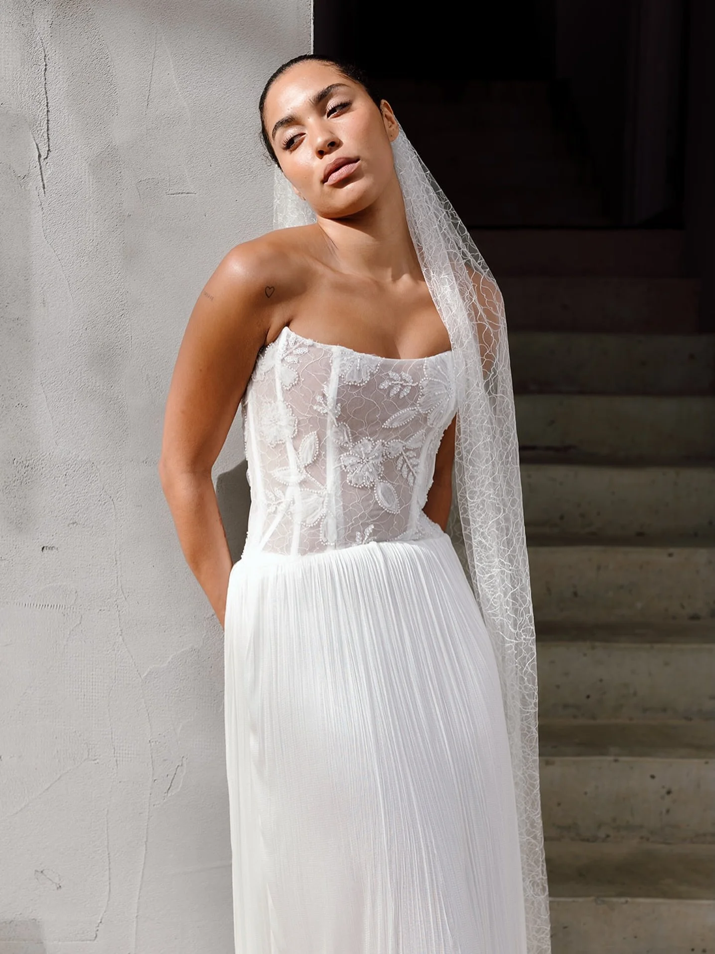 MEET TYLA &amp; LAUREN

The Tyla bodice features our classic structured scoop neck with convex hem. The slighly elongated waist creates the perfect canvas for layers of eyelash lace and beaded floral tulle appliques on a crinoline base for an illusio