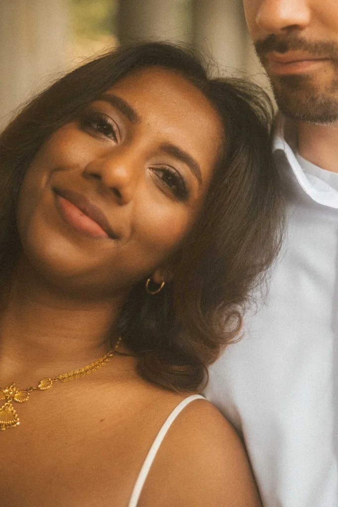 A tender and affectionate close-up portrait of a happy couple during an engagement photoshoot in Berlin.