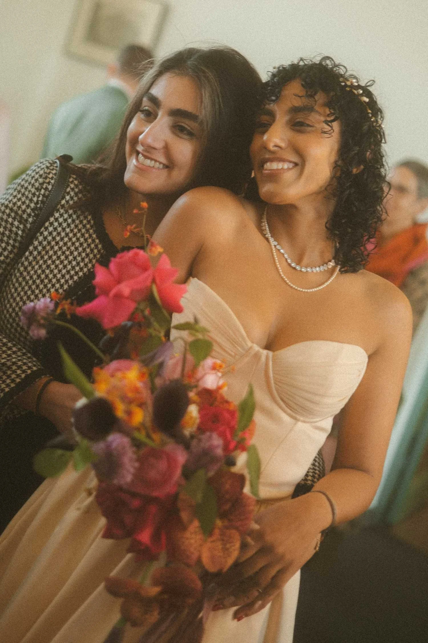 Bride smiling with a guest during a candid moment at a Standesamt wedding ceremony in Berlin