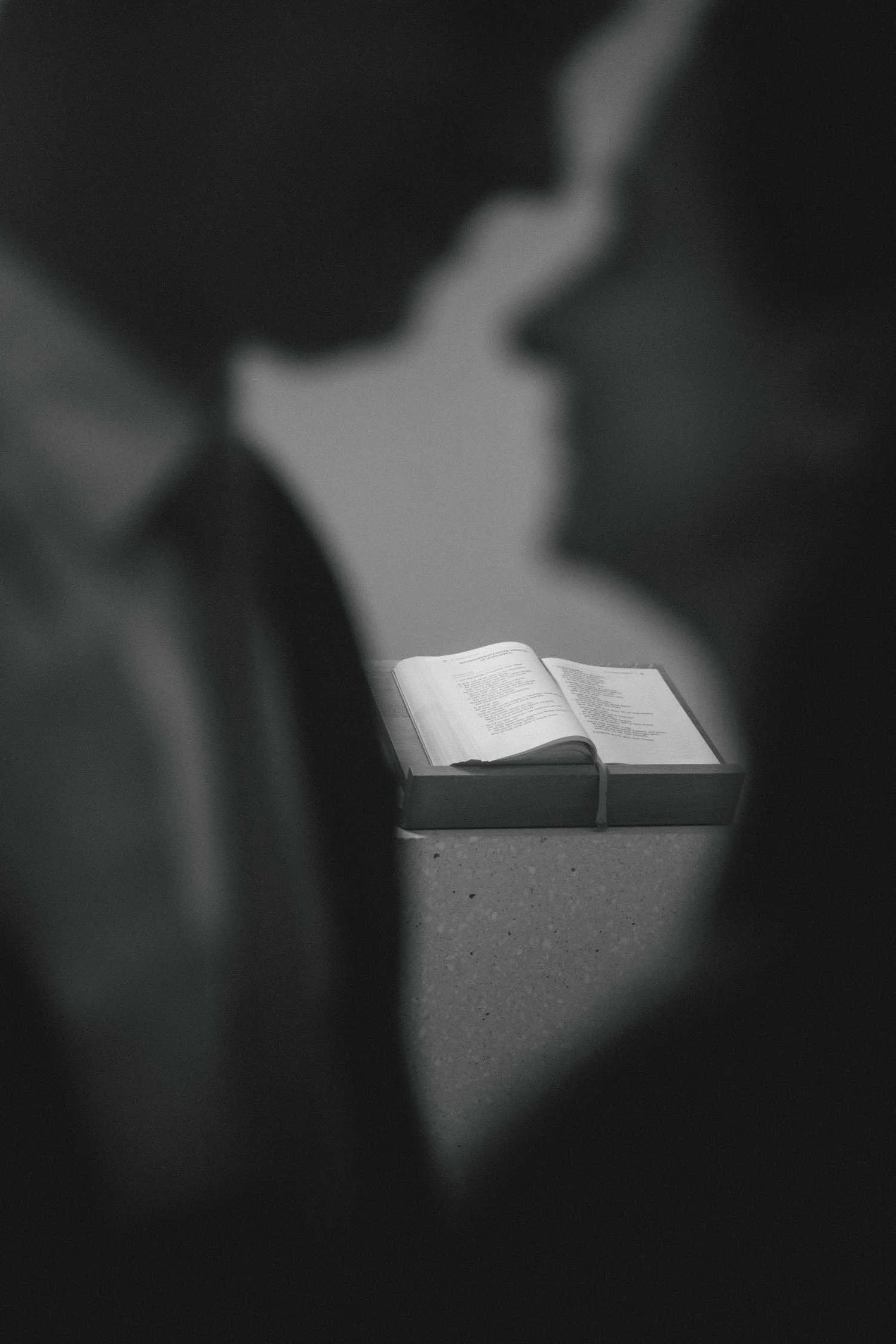 Black and white detail of open ceremony book during romantic proposal photoshoot in Berlin