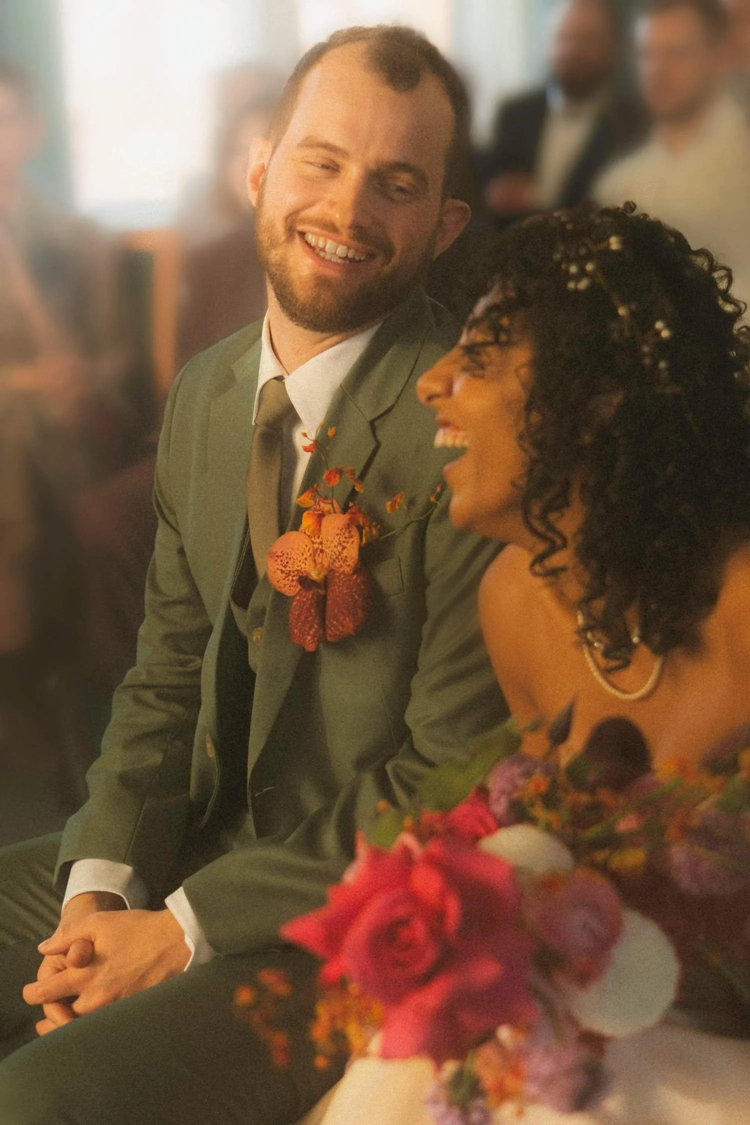 Bride and groom laughing together during their civil wedding ceremony at the Berlin civil registry office.
