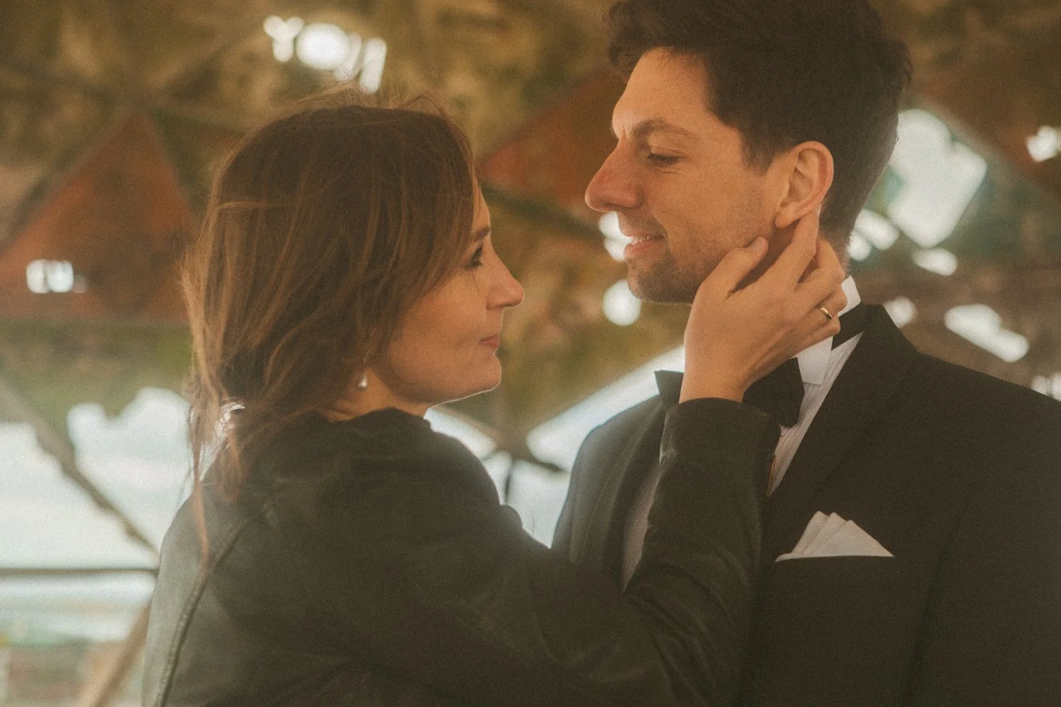 Bride gently holding groom’s face inside Teufelsberg radar dome during Berlin wedding photoshoot