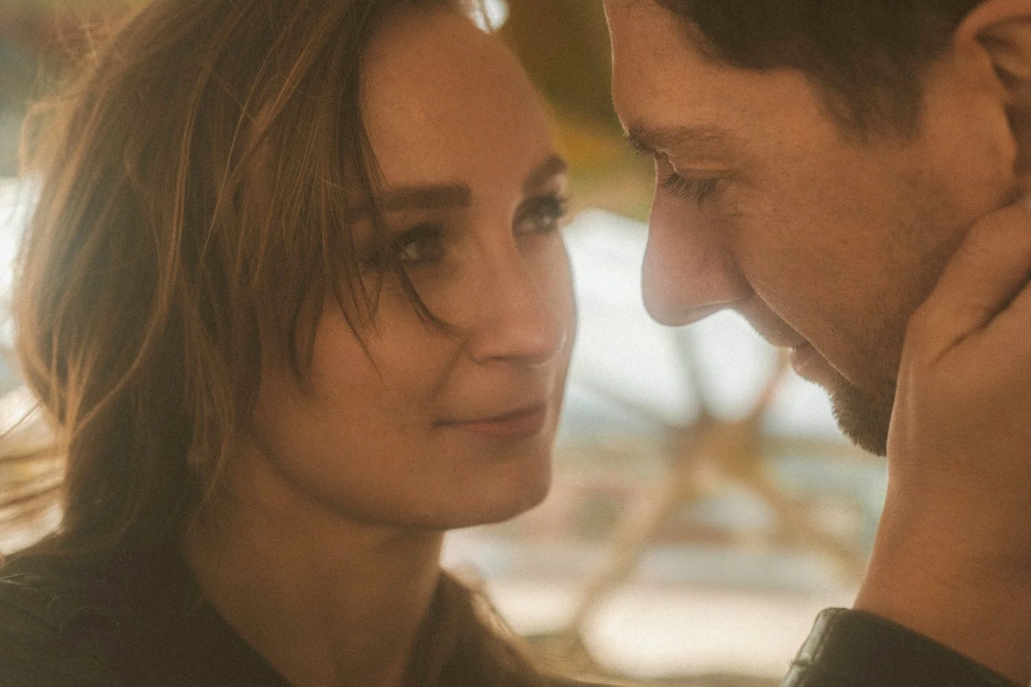 Intimate close-up of bride and groom touching foreheads during golden hour wedding photoshoot at Teufelsberg Berlin
