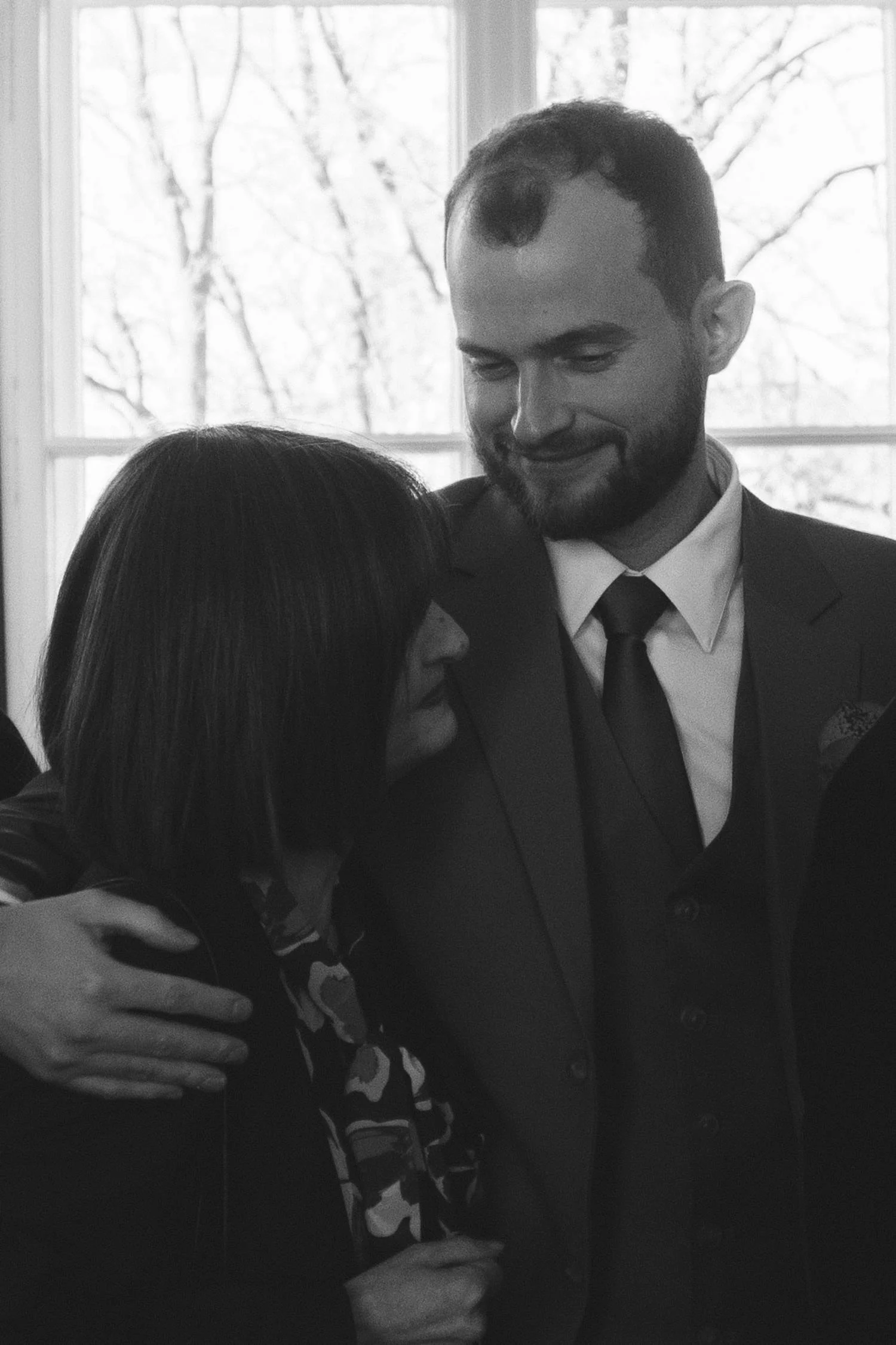 Emotional black and white portrait of a couple during their civil wedding ceremony at the Berlin civil registry office.