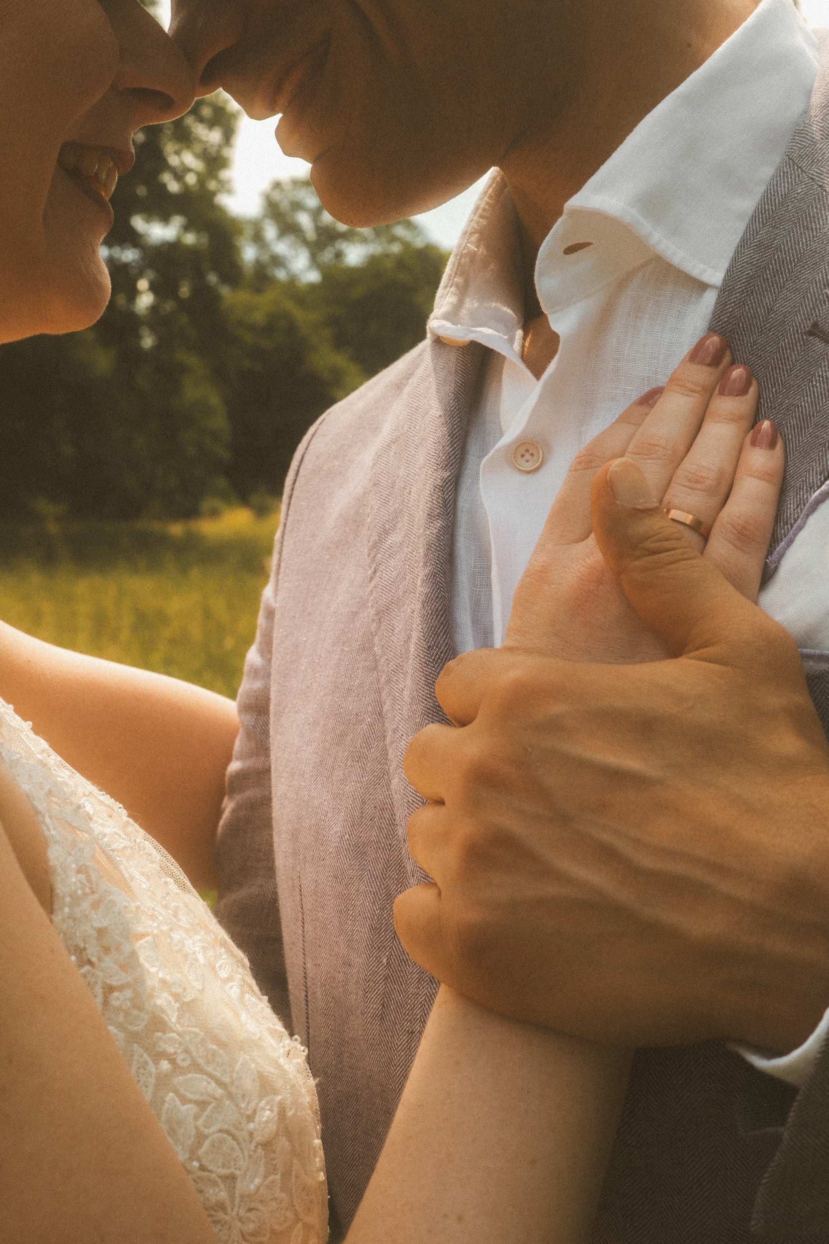 Couple smiling face to face in warm golden hour light at Berlin wedding portrait session
