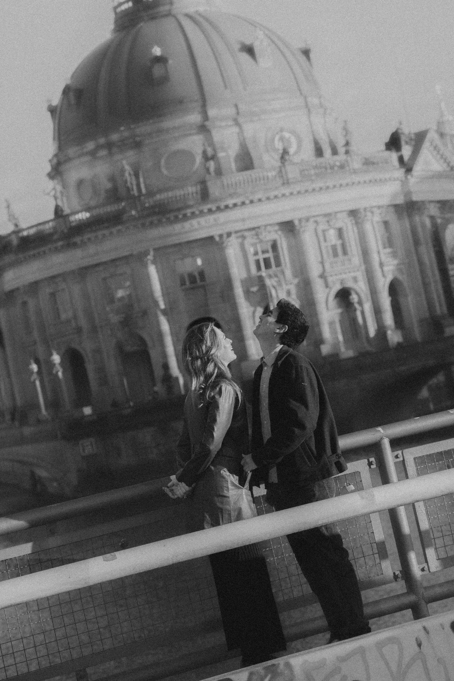 Candid couple photoshoot by the Spree River with Bode Museum in Berlin