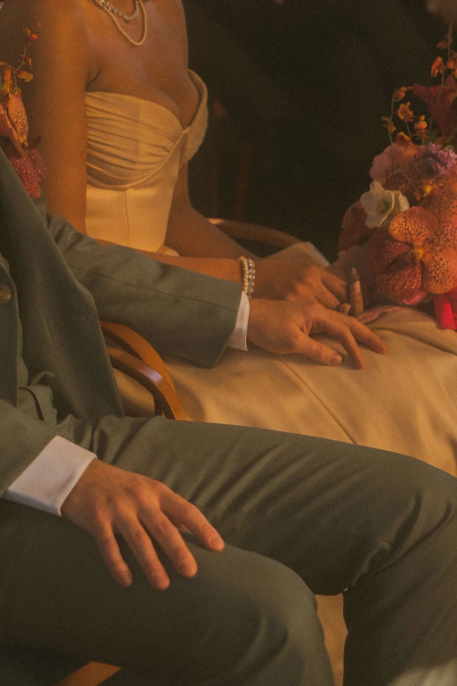 Close-up of the bride and groom’s hands resting together during a civil wedding ceremony at the Standesamt in Berlin