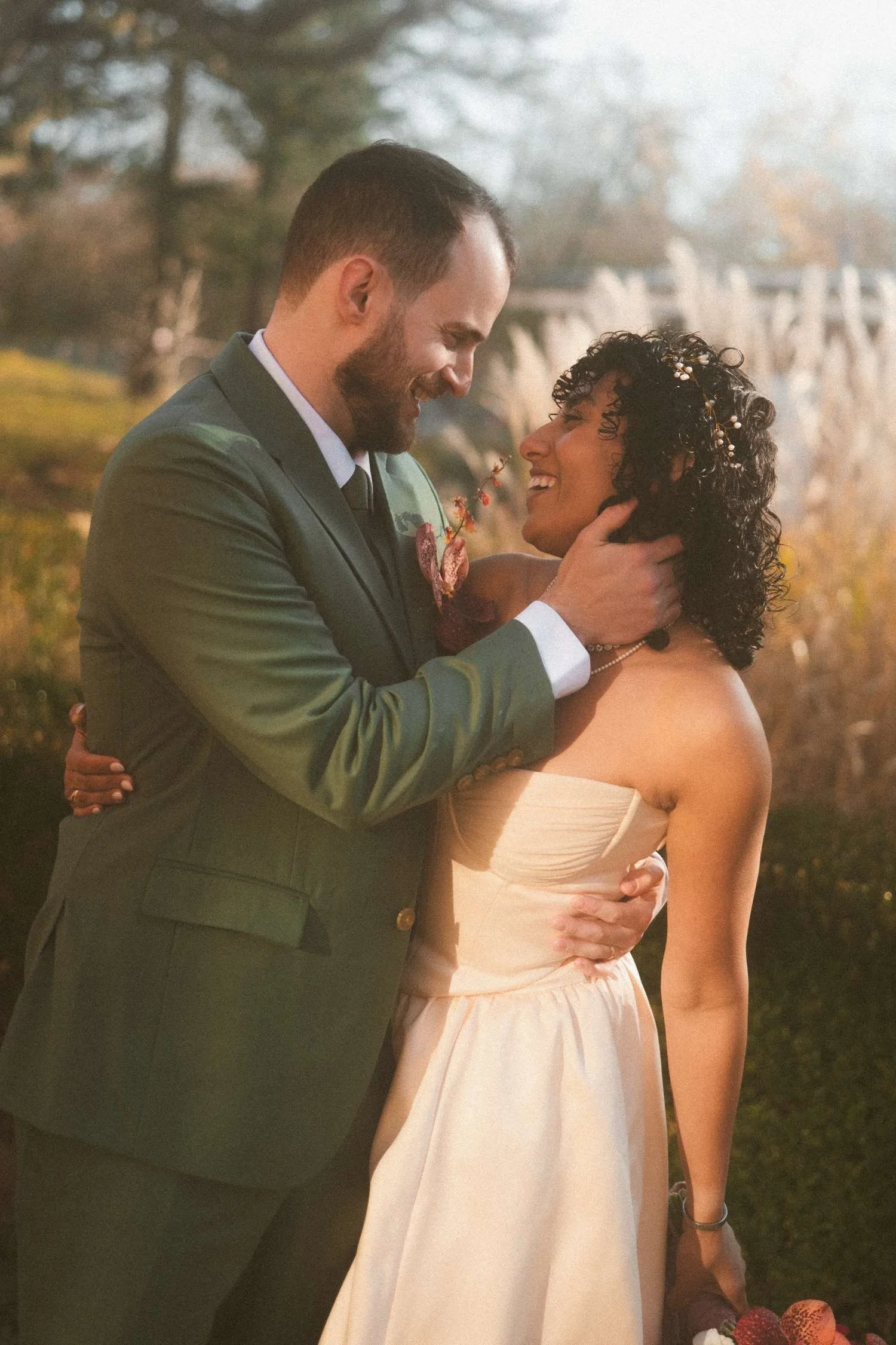 Bride and groom embracing and smiling together after their civil wedding ceremony.