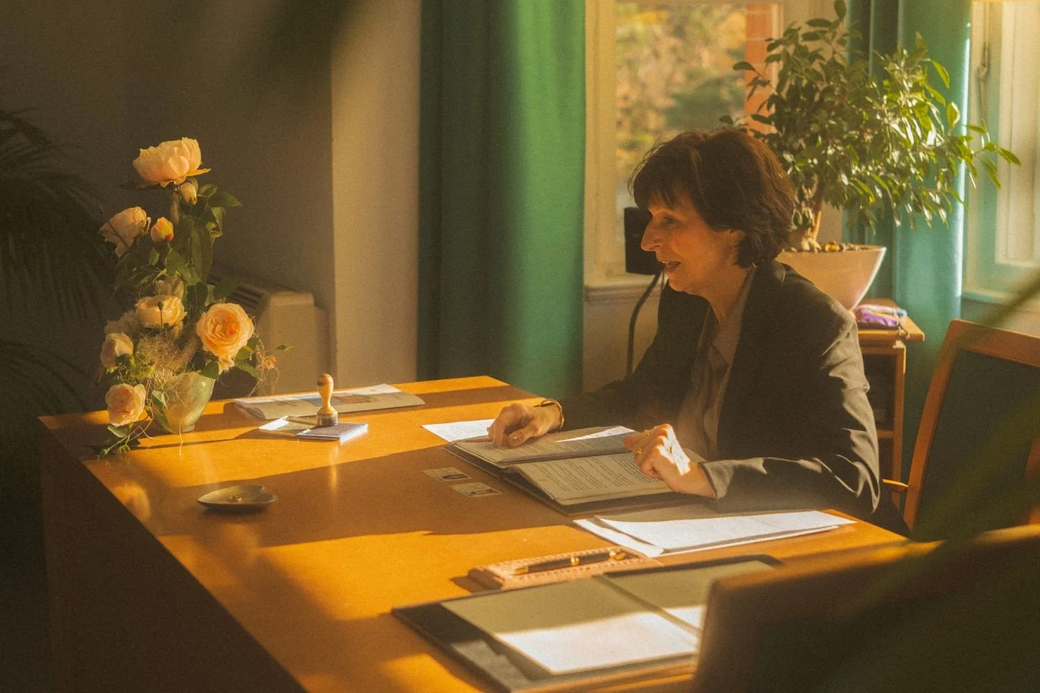 Registrar signing official documents during a civil wedding ceremony at the Standesamt in Berlin