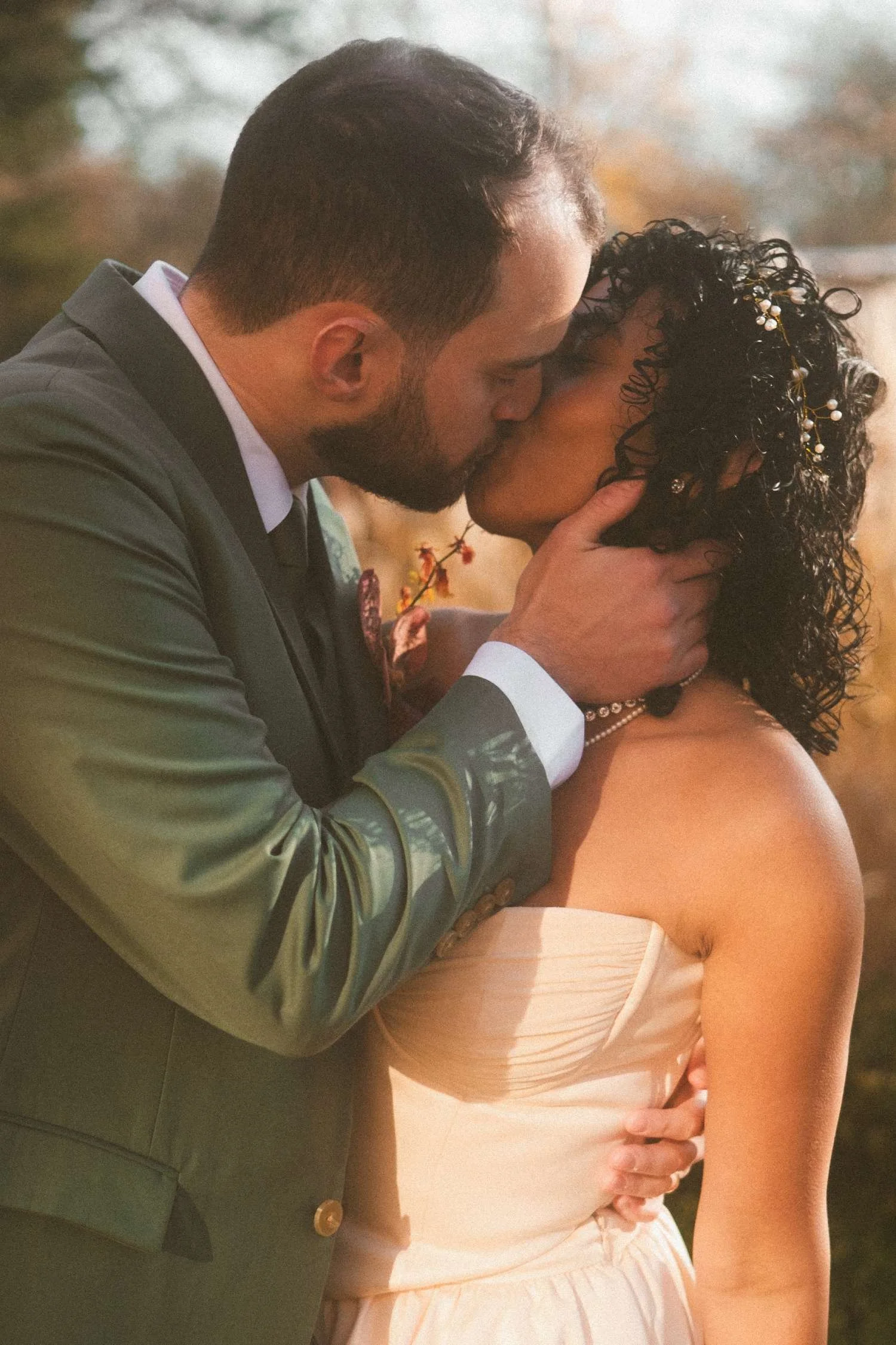 Bride and groom sharing an intimate kiss after their civil wedding ceremony.