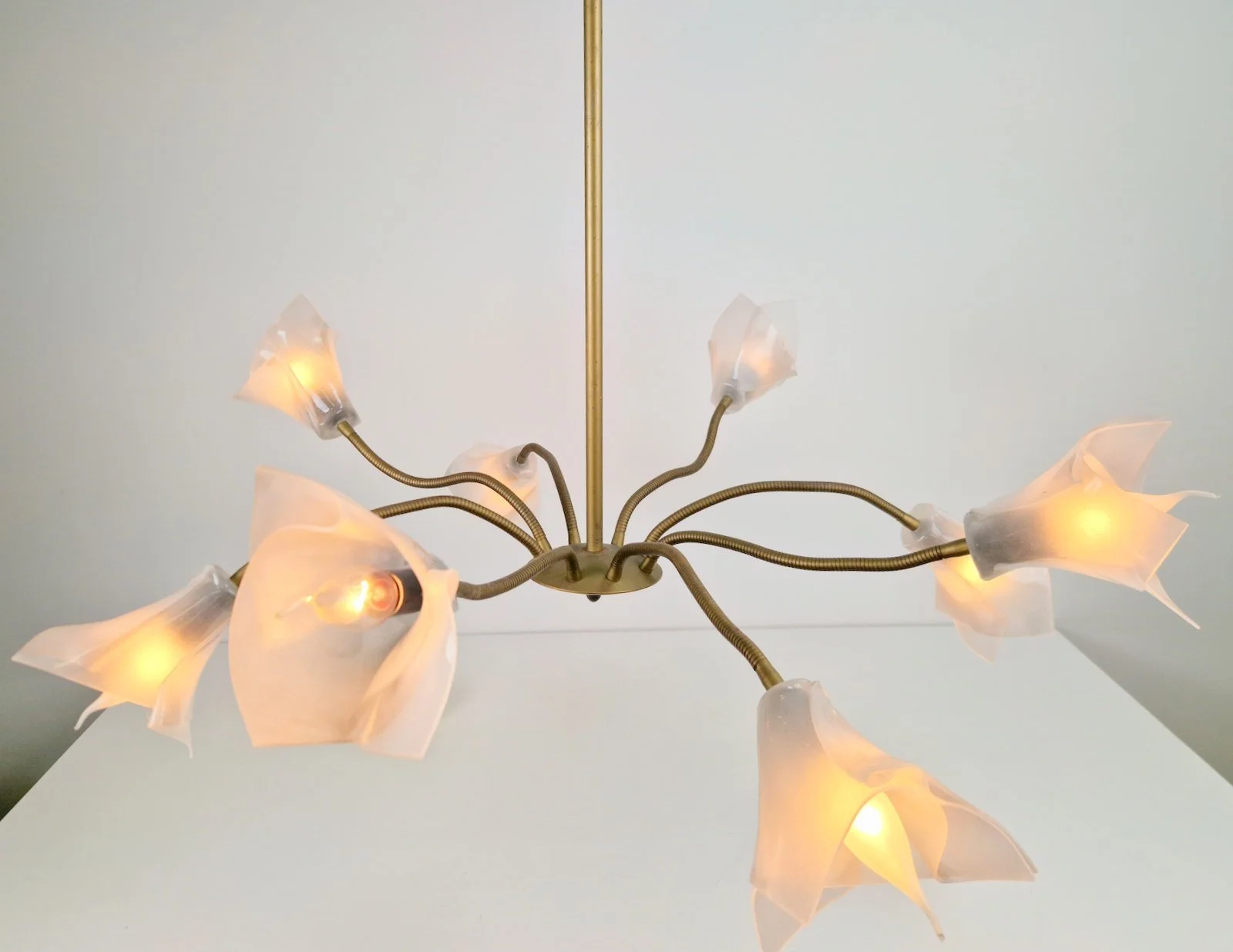 Brass Lucite flex pendant chandelier with 8 arms, 1970