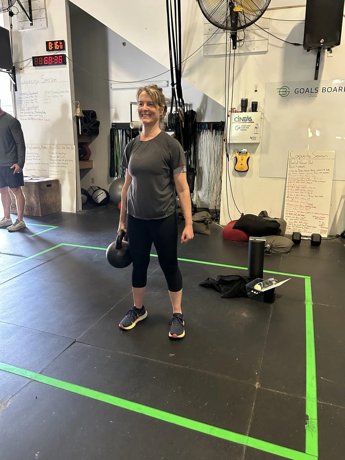 GBSC member building strength with a kettlebell during a coached class in Newington, New Hampshire