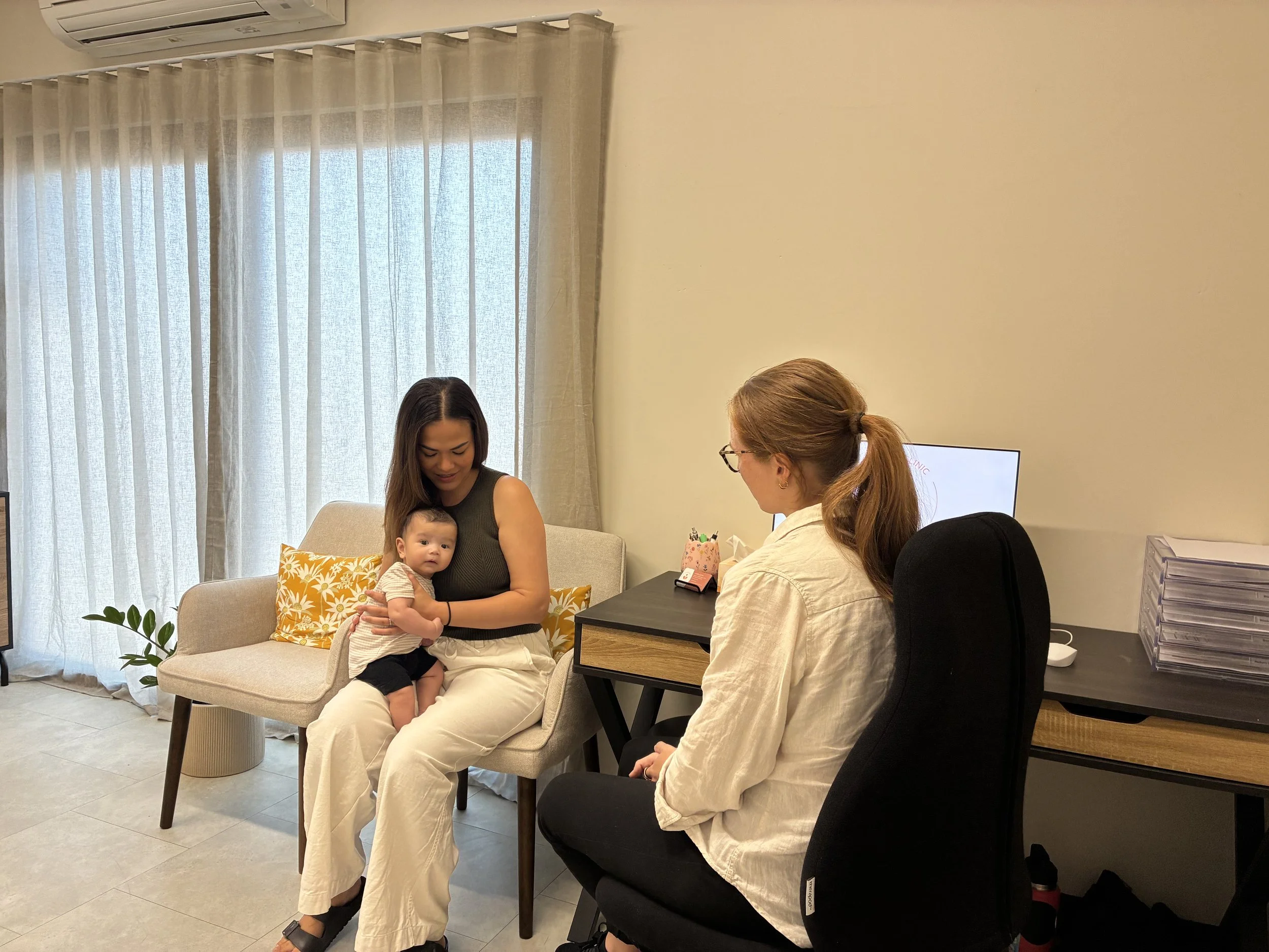 new mum and baby at physio consult