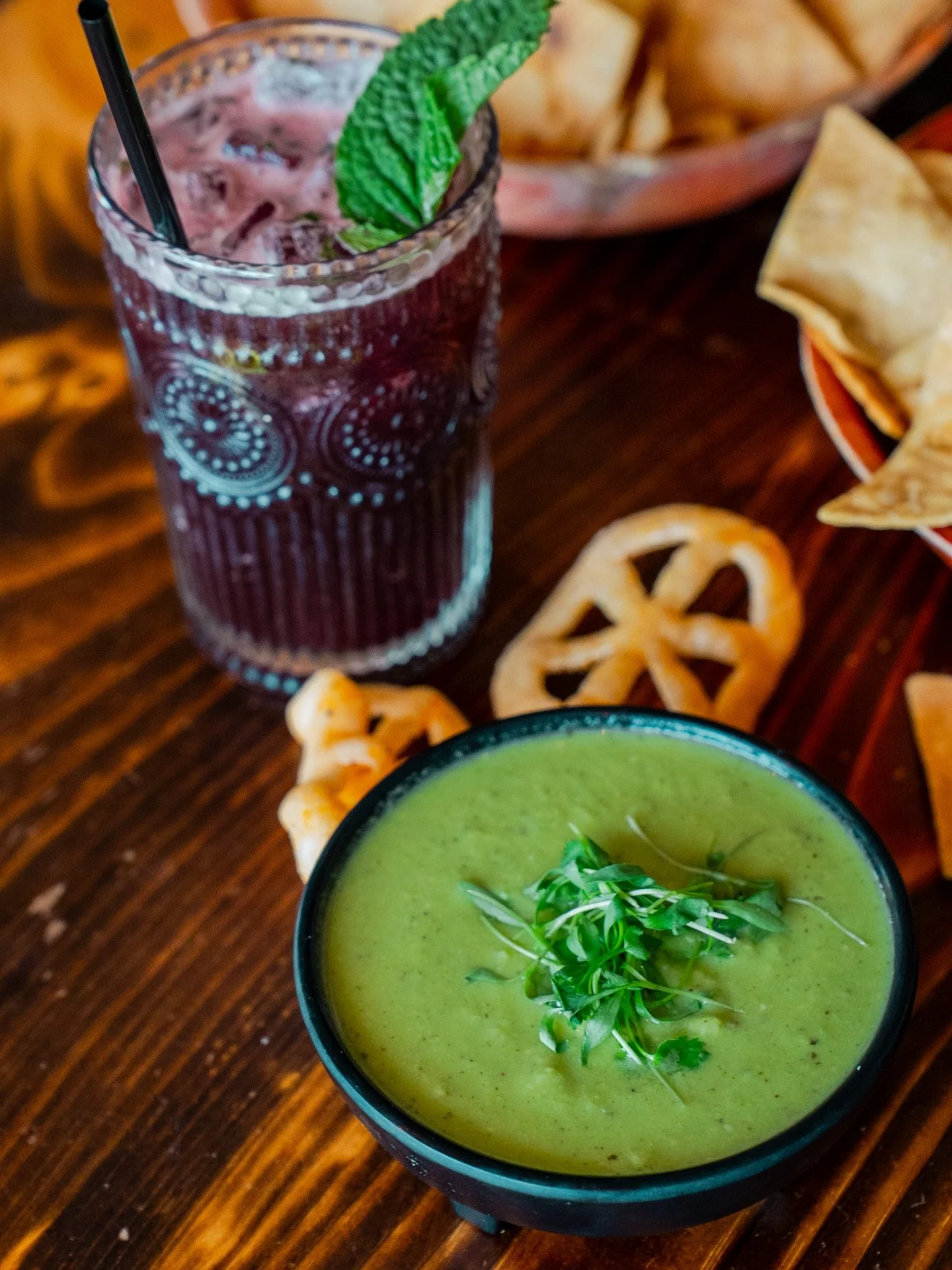 A little old and a little new in this photo. The Dos Flores Mojito, made up of tequila blanco, hibiscus, lime, and mint was one of the cocktails from our original menu in 2014. 
Below that is our casera salsa, a 2025 menu addition. Made from jalape&