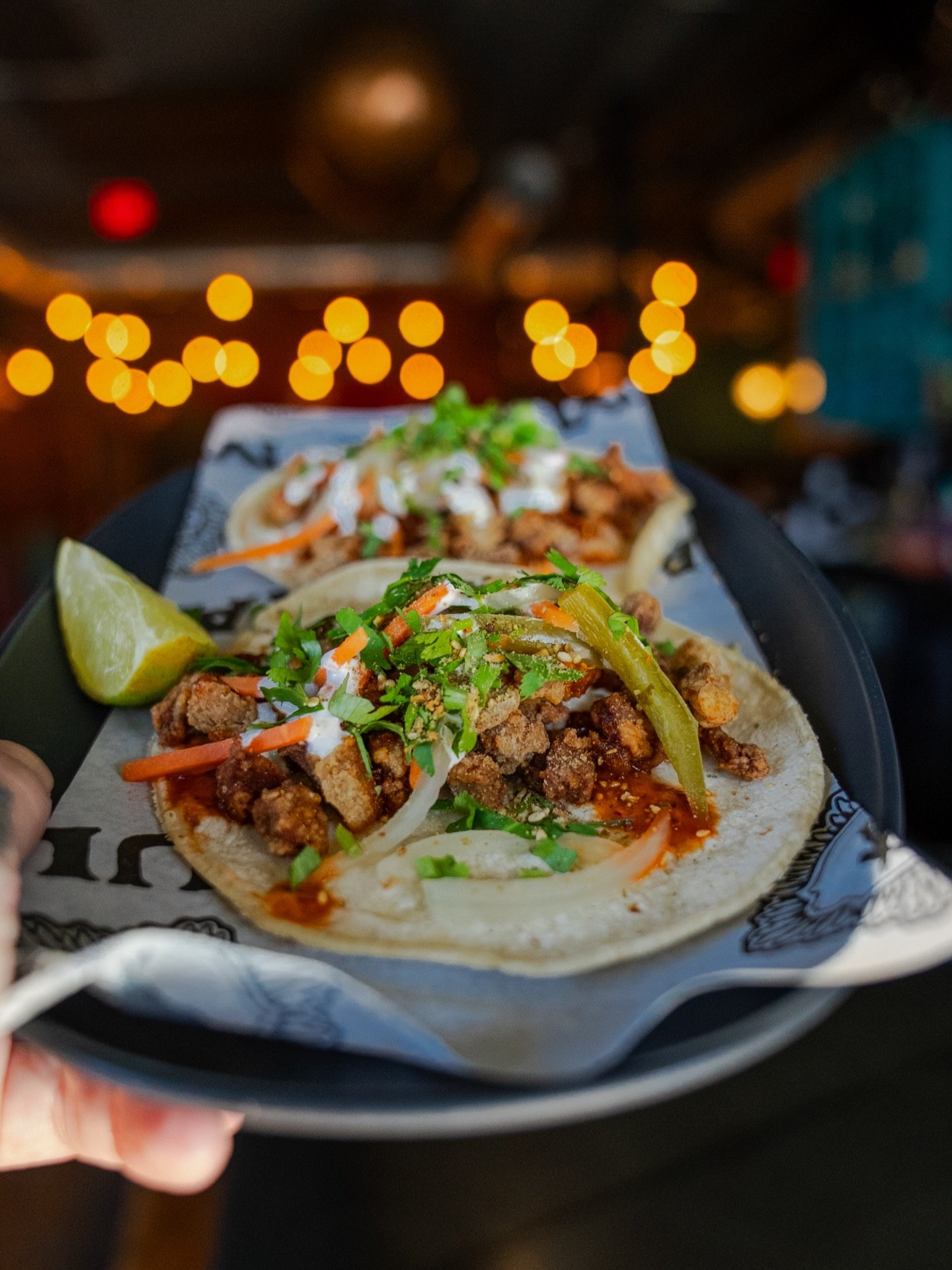 A fan favorite for this week&rsquo;s Thursday special! Chicharron tacos! Crispy fried pork, chipotle glaze, crema, escabeche, cilantro, roasted pepitas, and sesame seeds on a flour tortilla. Today only.
