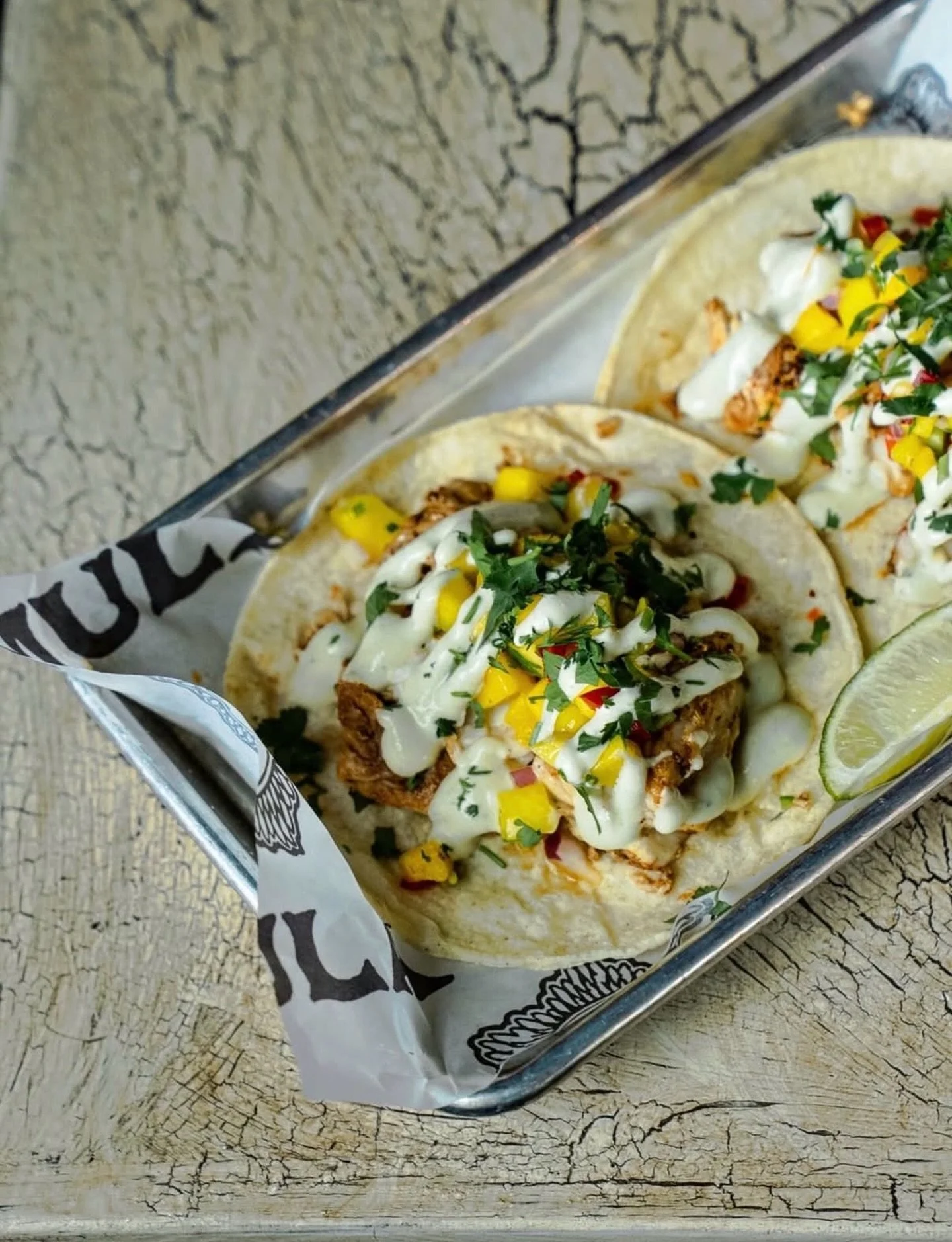 Mahi tacos for this weeks Thursday special. Spice-rubbed mahi mahi, mango salsa, spicy avocado crema, cilantro on a corn tortilla. Today only!