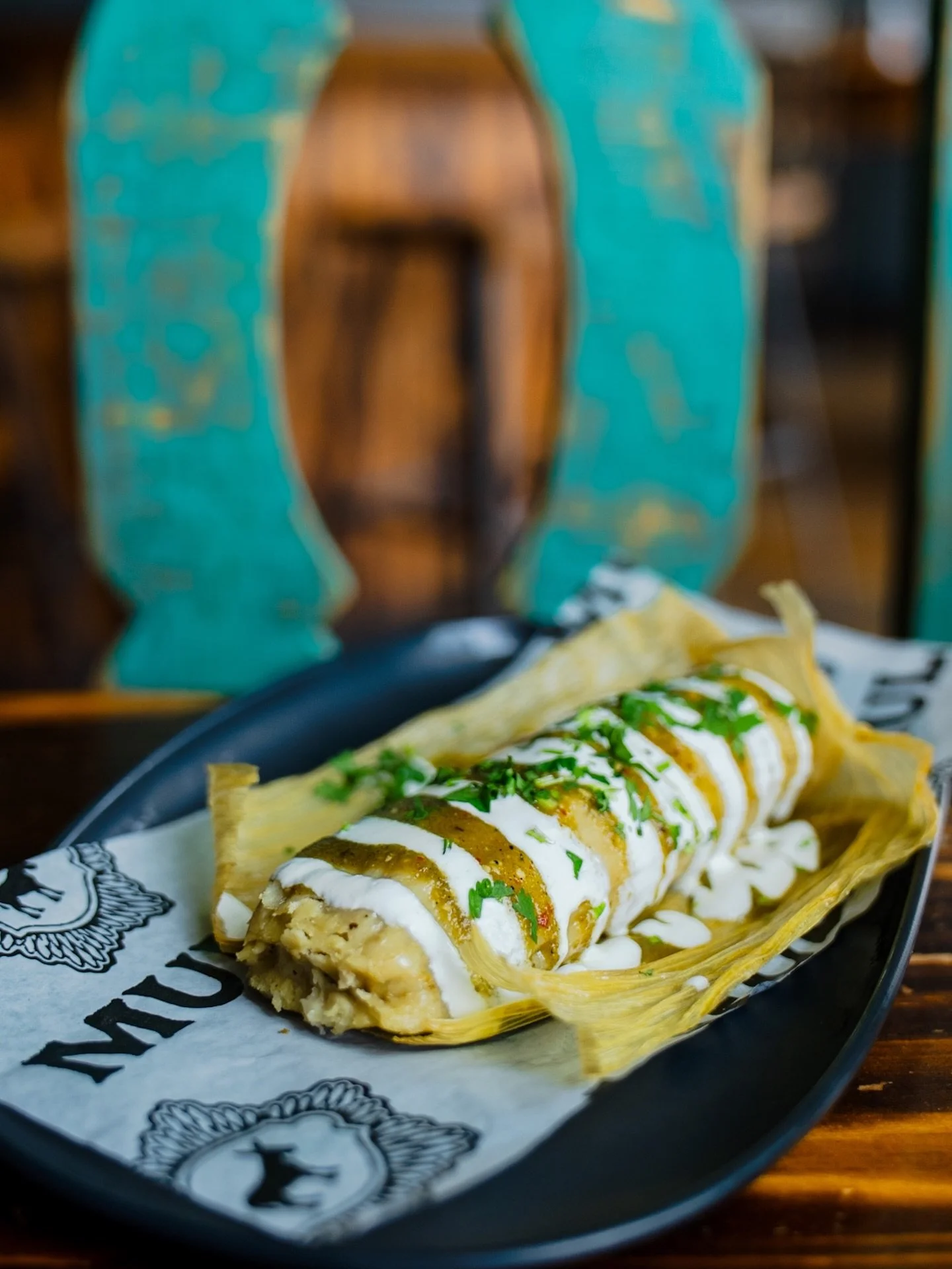 Tamale Wednesday! Hot and fresh tamales every Wednesday until we sell out. We have a verde chicken tamale today. Homemade tamale, shredded chicken, tomatillo salsa, crema, and cilantro.