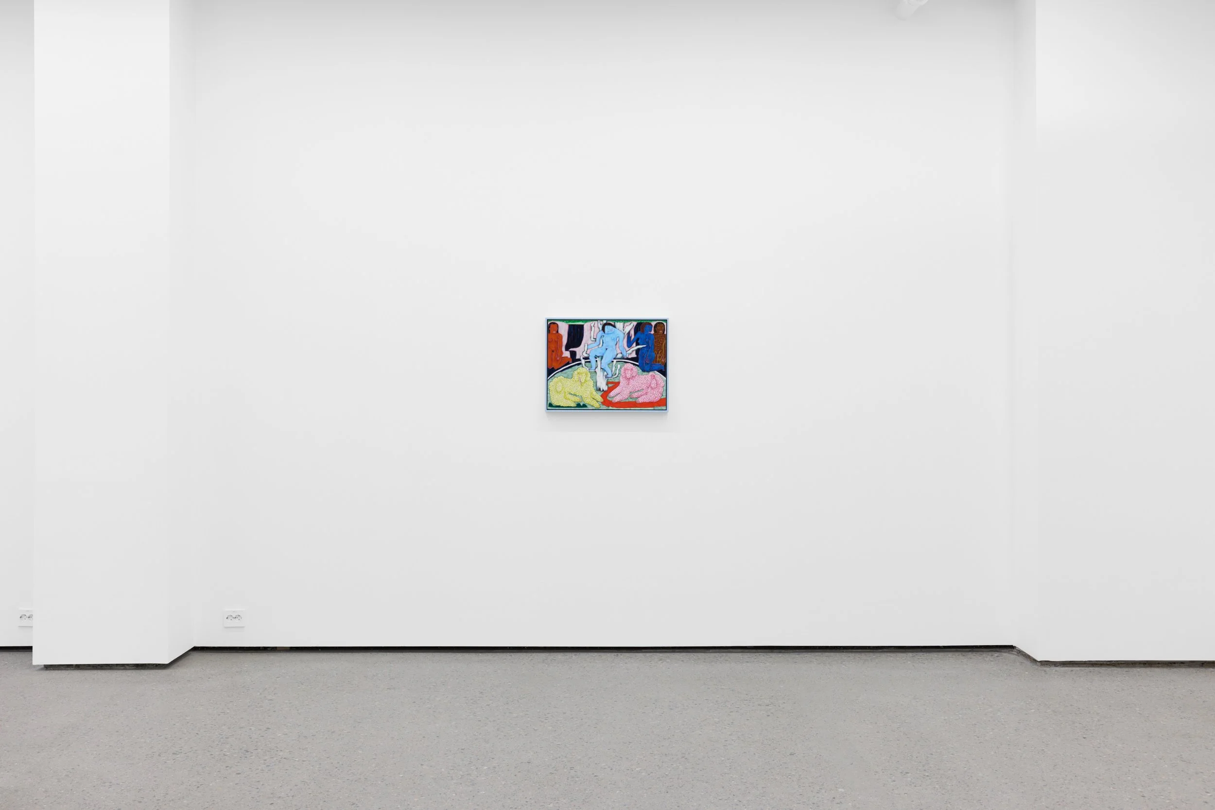 A small colorful painting hangs on a plain white gallery wall, with a grey carpeted floor in front.