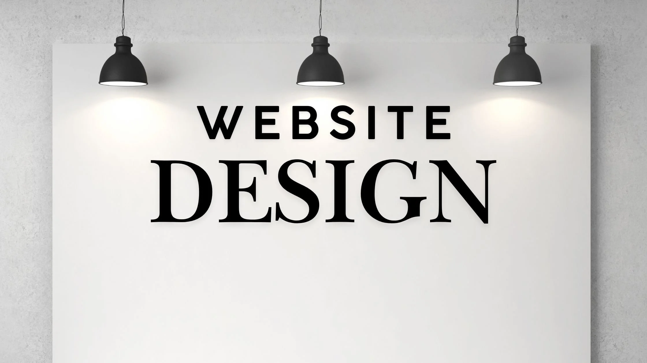 A white wall with three hanging black lamps illuminating the wall, which has the words 'WEBSITE DESIGN' written in bold black letters.