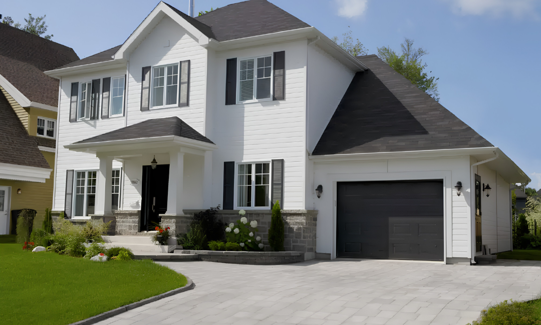 An image of a white house with White Maibec CanExel siding