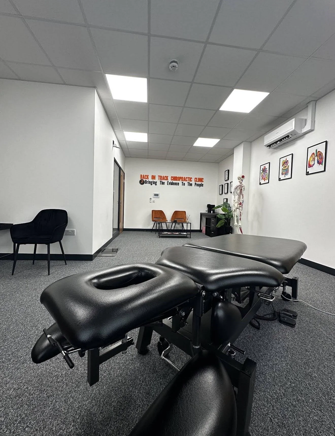 Back On Track Chiropractic Clinic consultation and treatment room in Wolverhampton. Showing a treatment table for back pain, neck pain, shoulder pain, knee pain, hip pain, sports injuries, headaches and more.