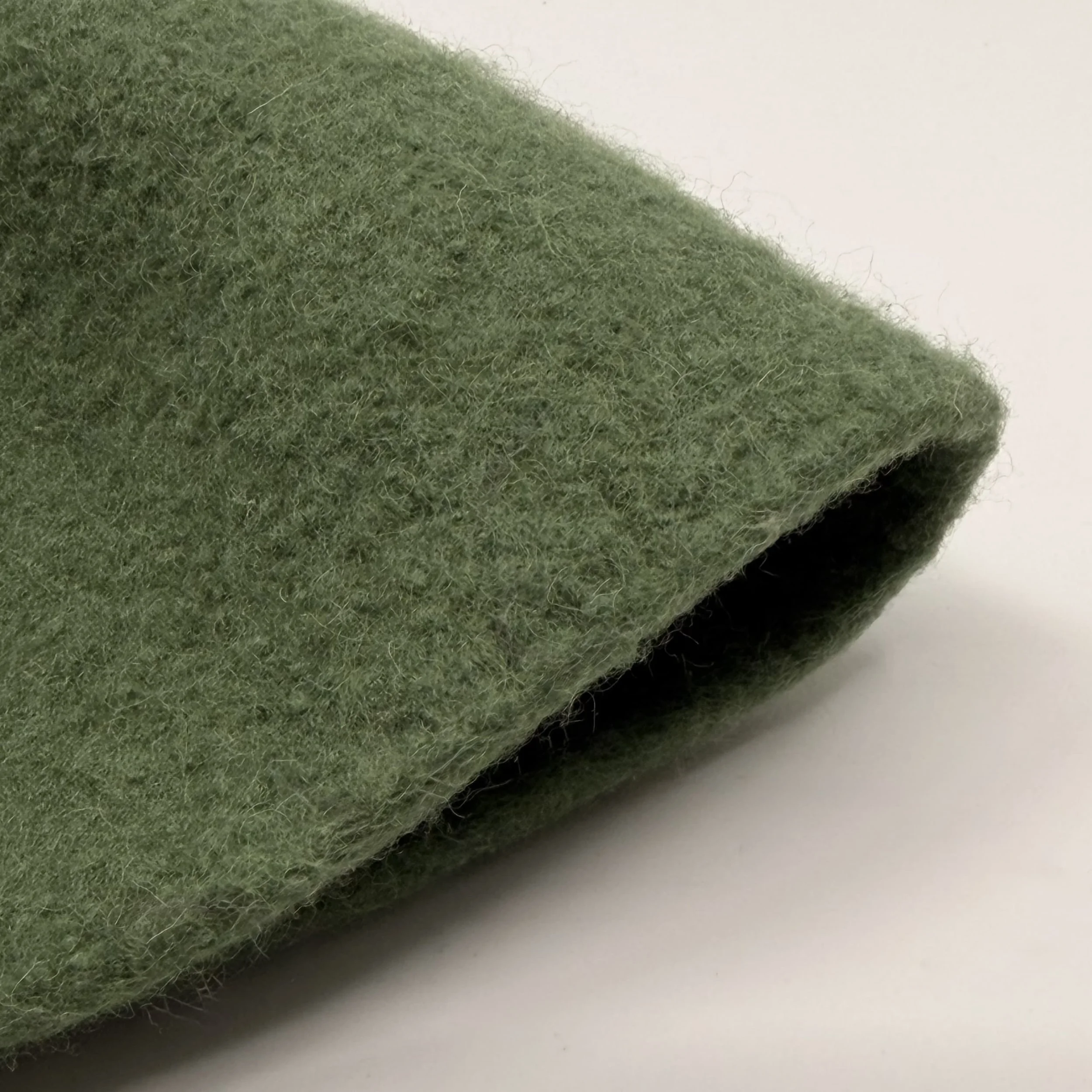 Bondon tall wool cap in Fir Green, detail view