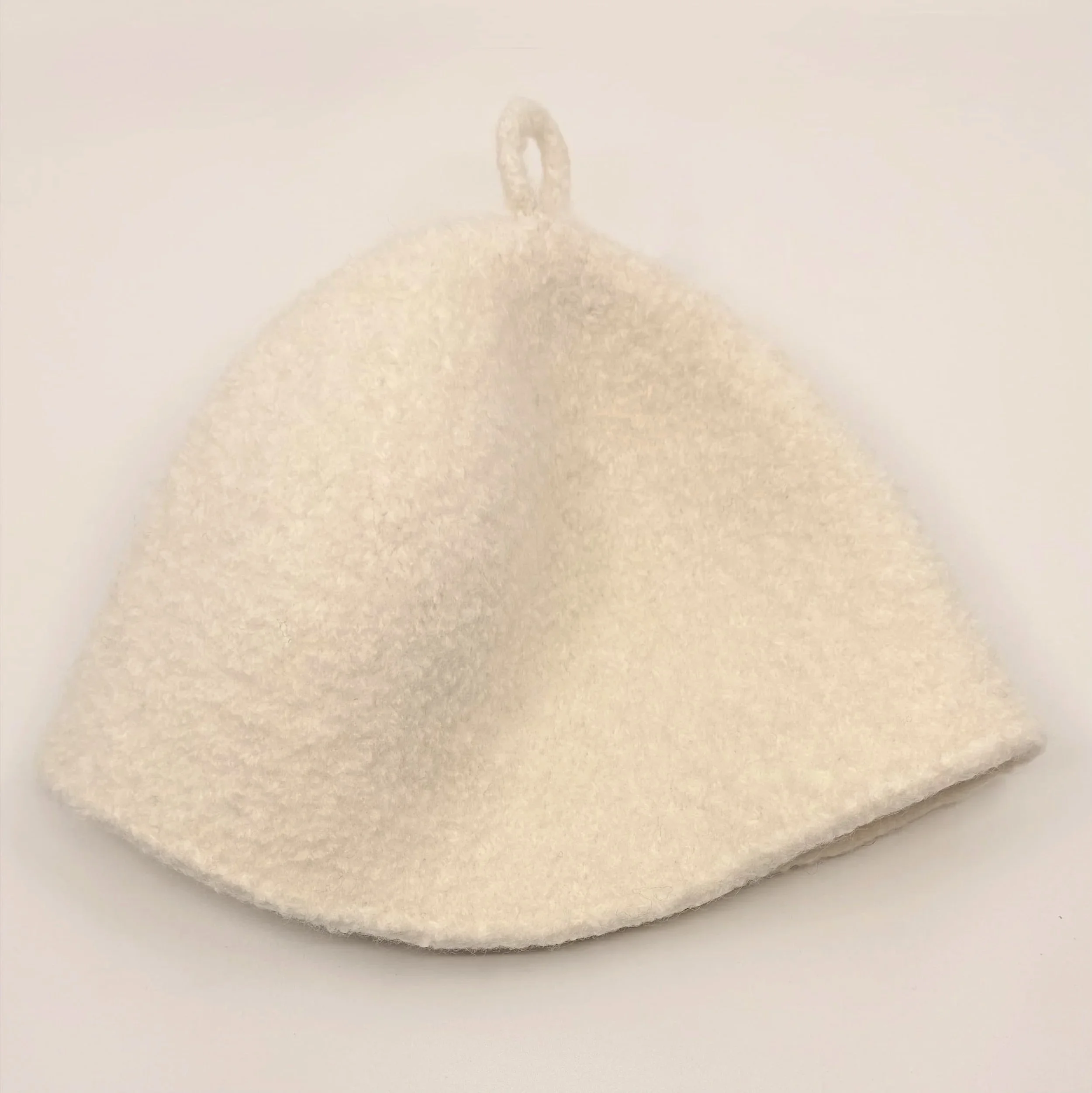 Bondon seamless wool sauna hat in Buff Cream, flat view