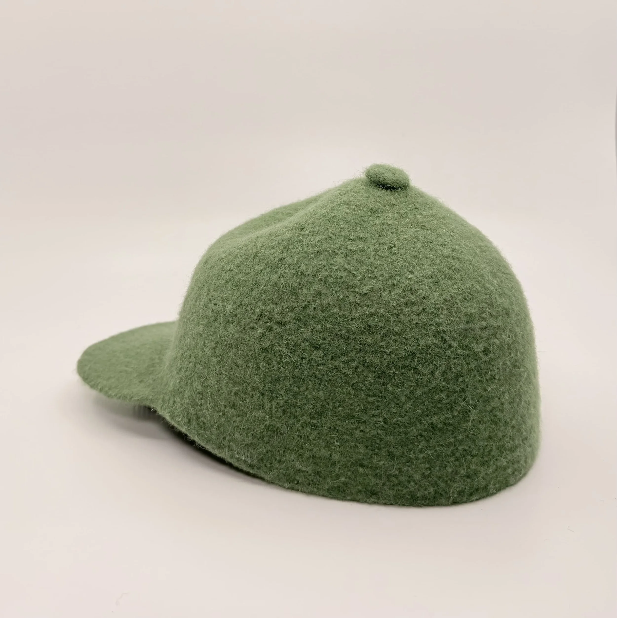 Bondon tall wool cap in Fir Green, back view