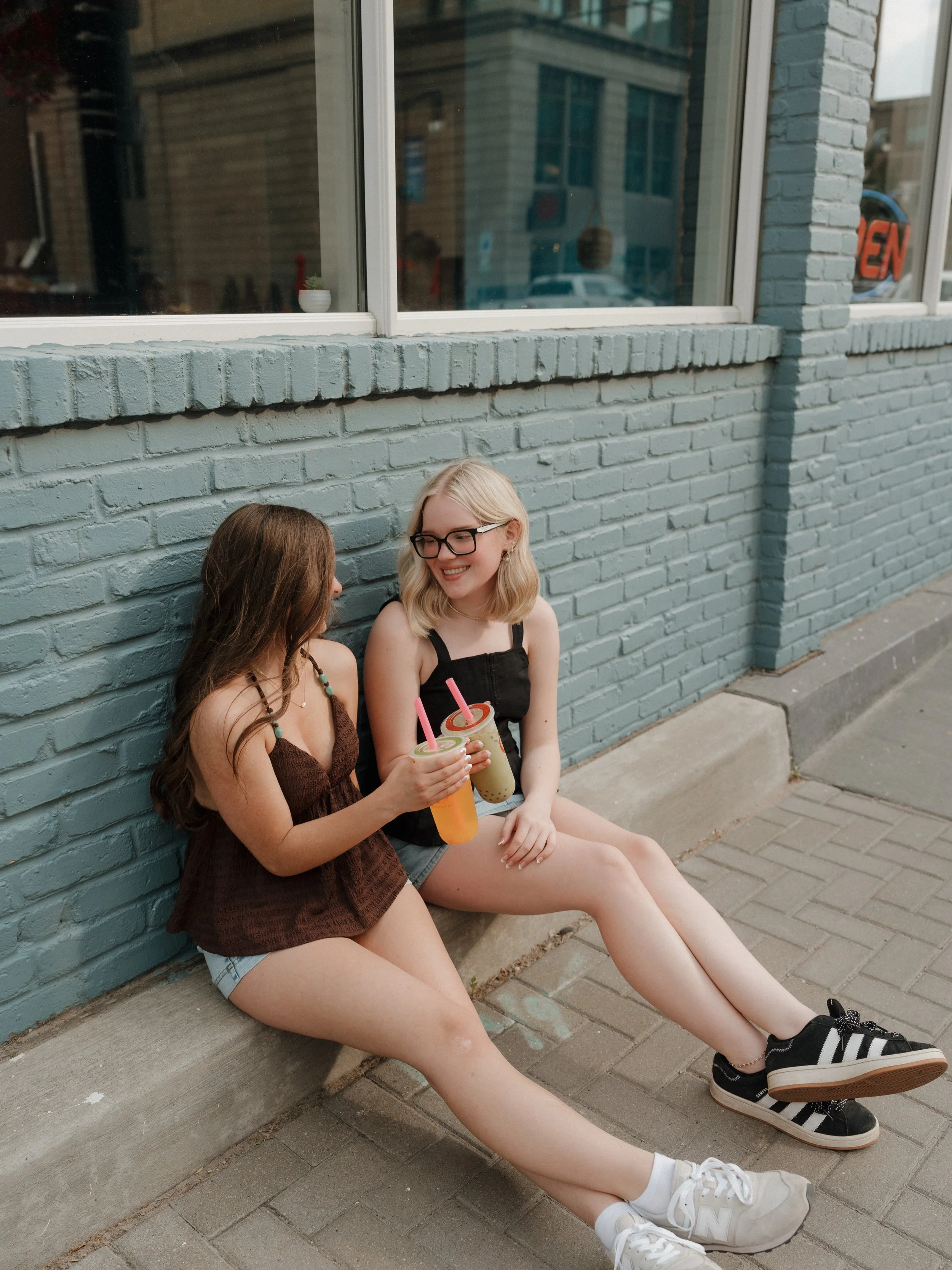 Two best friends, a sweet treat stop, and the flower bouquets they made themselves. It was fun getting to incorporate some of the little things that make their friendship so special and feel true to them. Senior photos are even better with your best 