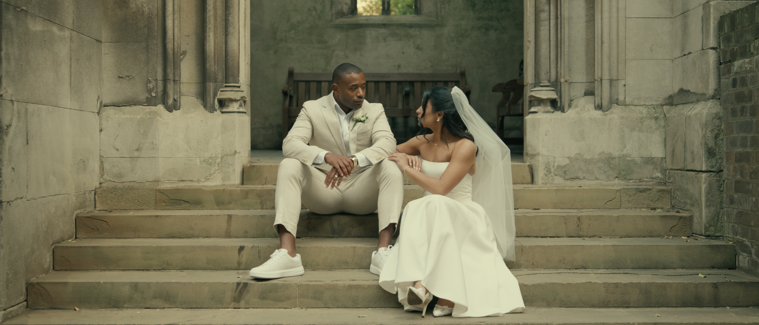 Intimate elopement in London with couple exploring st dunstan in the east