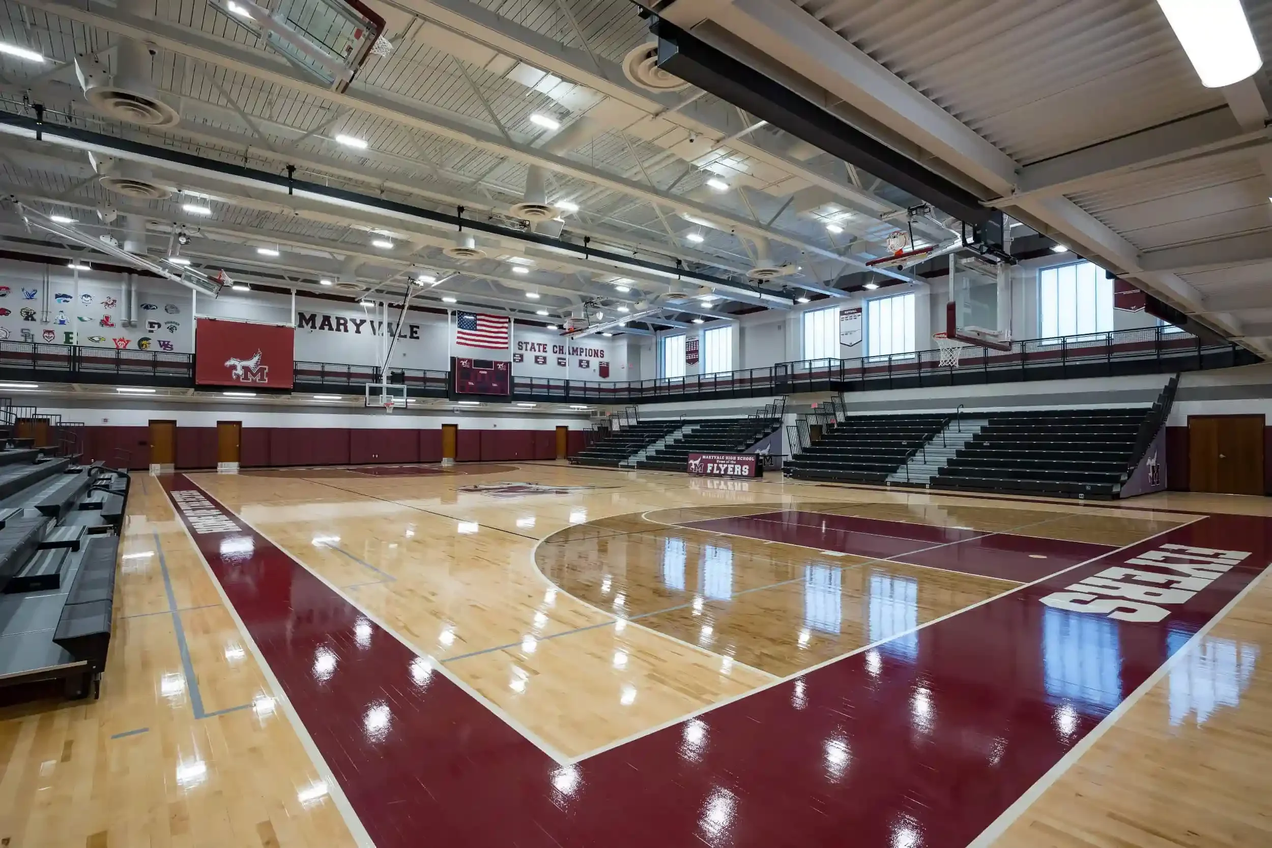 A view of the new gymnasium, with the school's maroon colors in the foreground