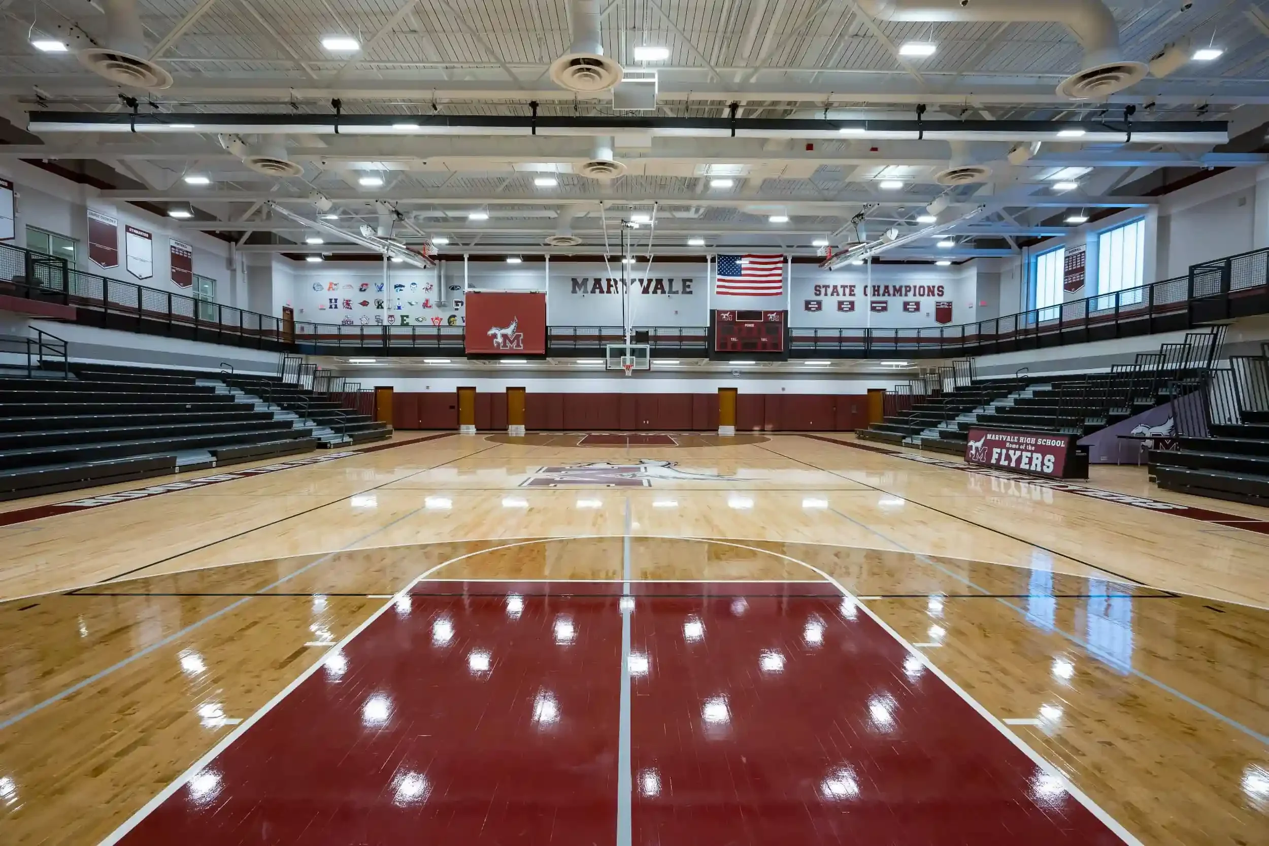 A view of the new gymnasium, with the school's maroon colors in the foreground