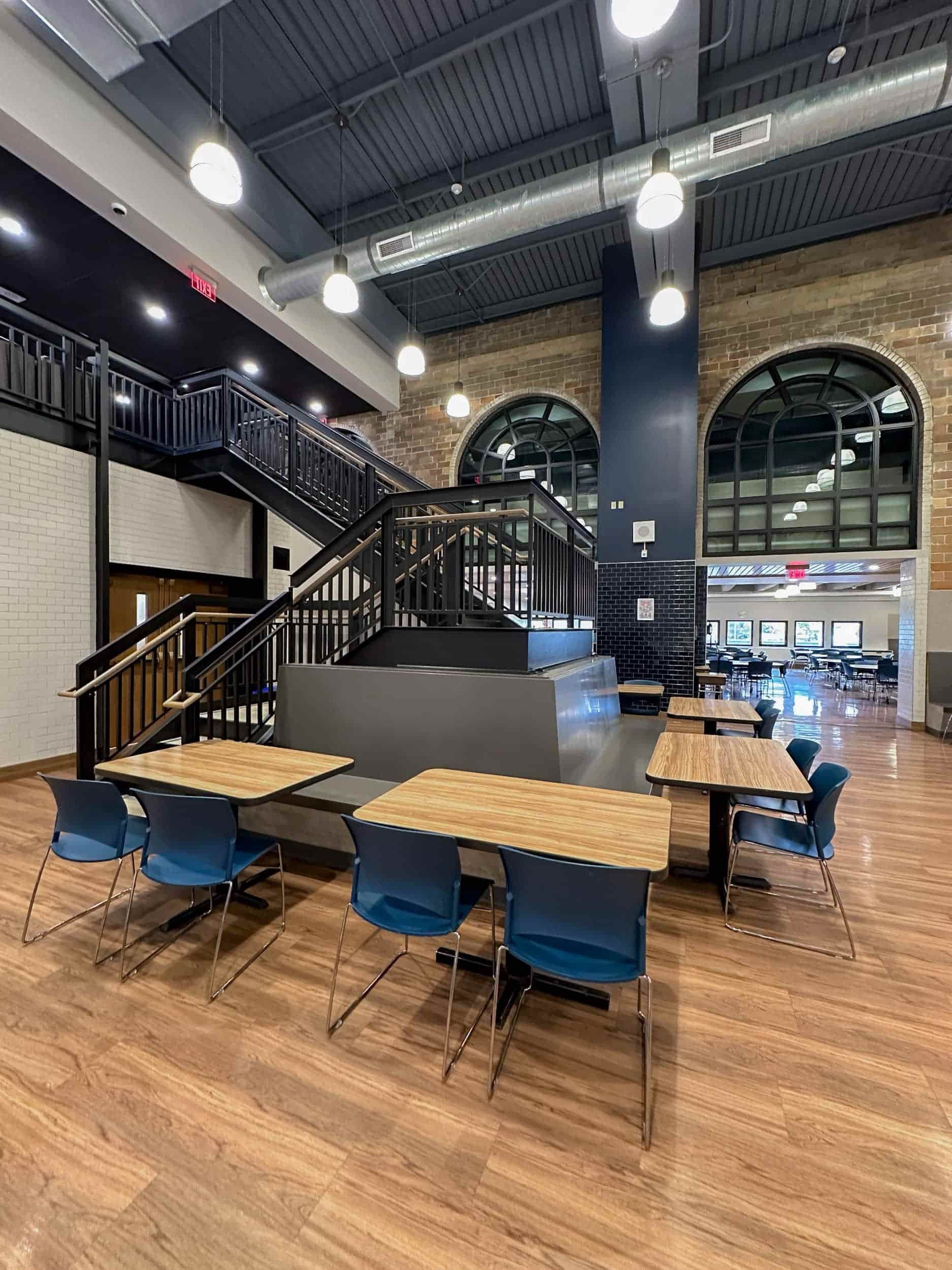 A view of the hardwood floors and industrial design accents at Falconer's cafeteria