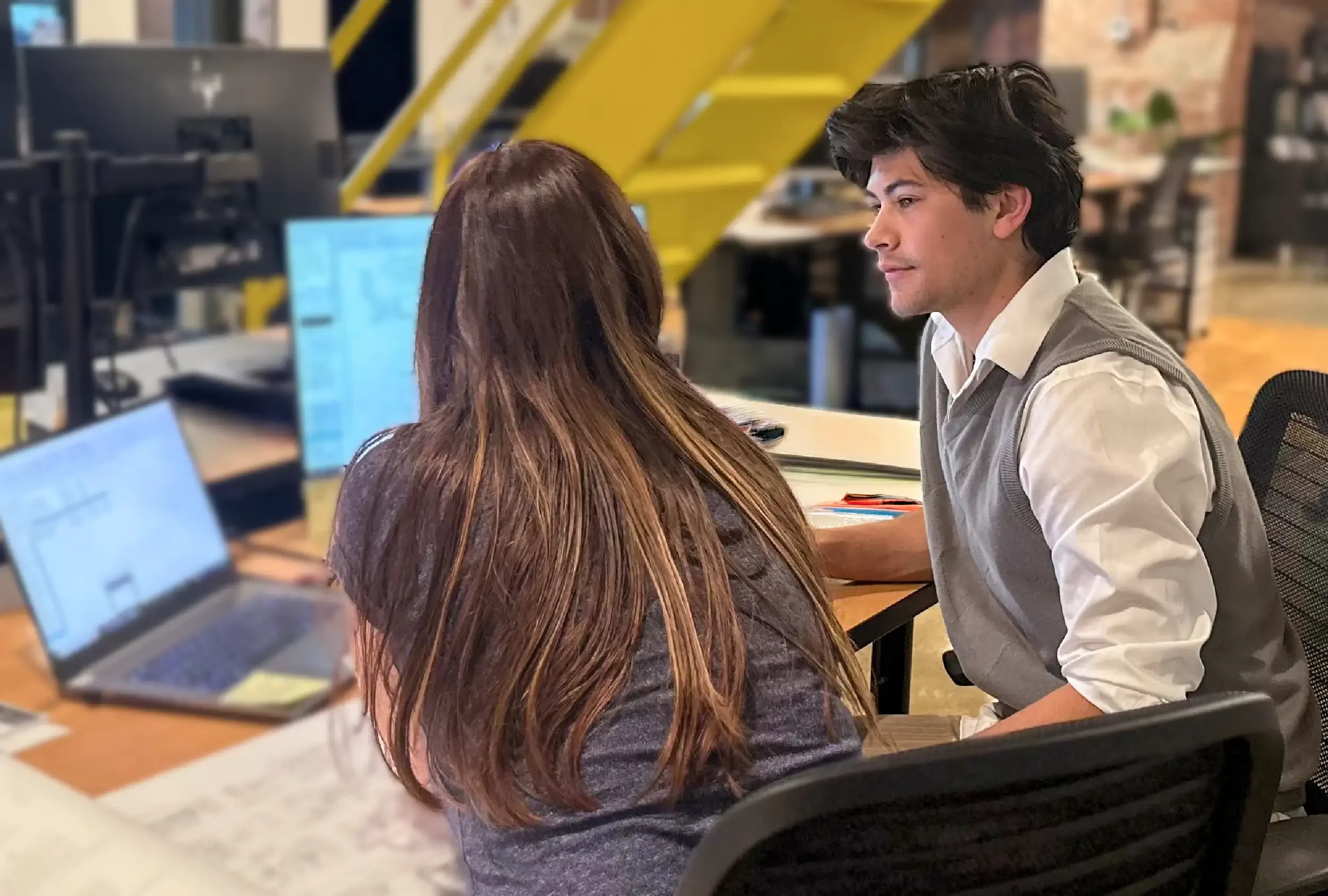 Two architects working together at a computer
