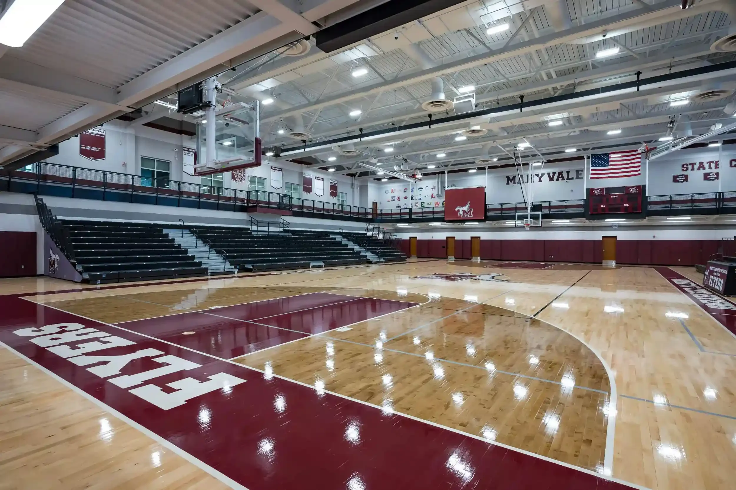 A view of the new gymnasium, with the school's maroon colors in the foreground