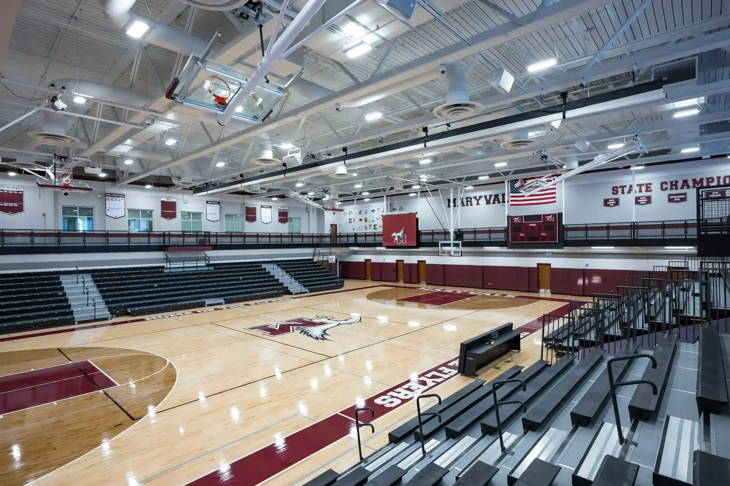 A view of the new gymnasium, with the school's maroon colors in the foreground