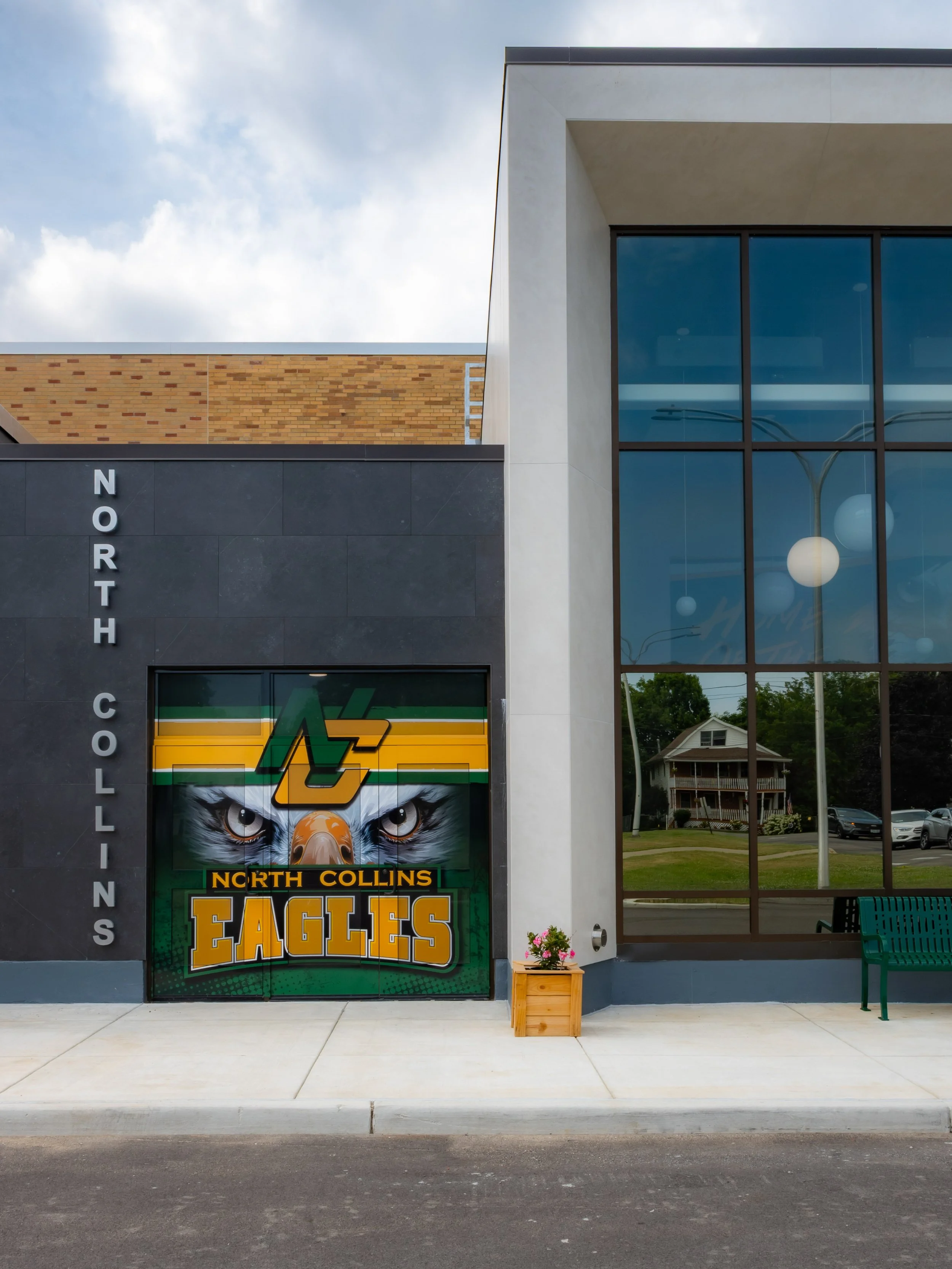 The athletic entry exterior at North Collins CSD with the school's logo prominently featured
