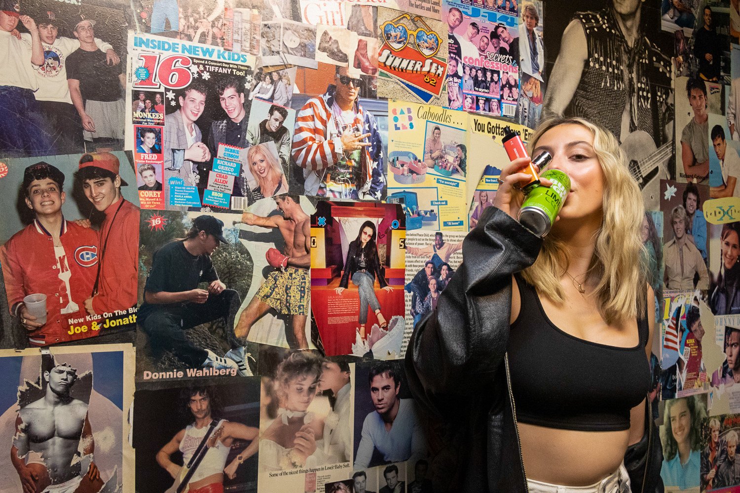As she holds her lip gloss, beer, and vape, Lindsay Best poses in the bathroom at the VS Arcade Bar in the Haymarket District of Lincoln. Generation Z is known for their vaping habits, as they have the highest percentage of e-cigarette users compared