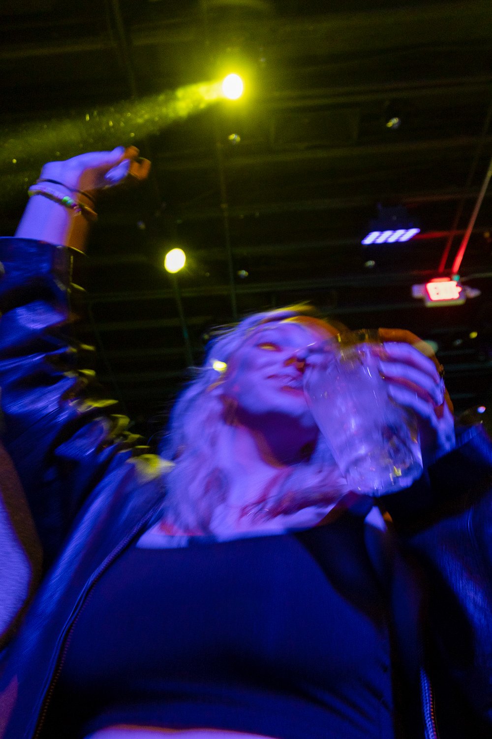 Lindsay Best, 21, dances alone by the DJ at Junction Nightclub on Feb. 25 in Lincoln, Neb. With a vodka soda in her left hand, Best smiles enjoying her time alone on a Saturday night. Photo by Meredith Gamet.