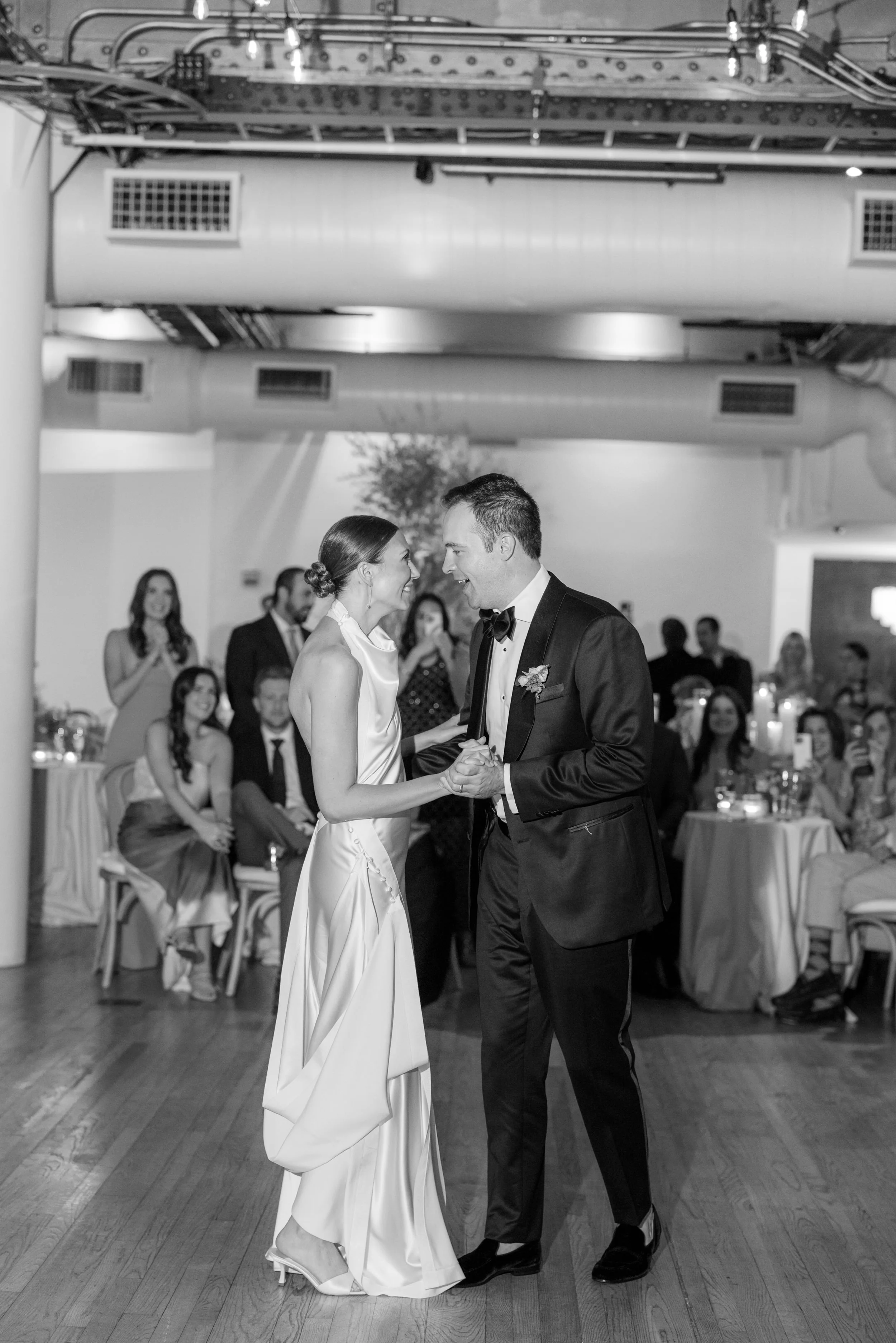 Romantic first dance moment between bride and groom during their Chelsea NYC wedding reception.