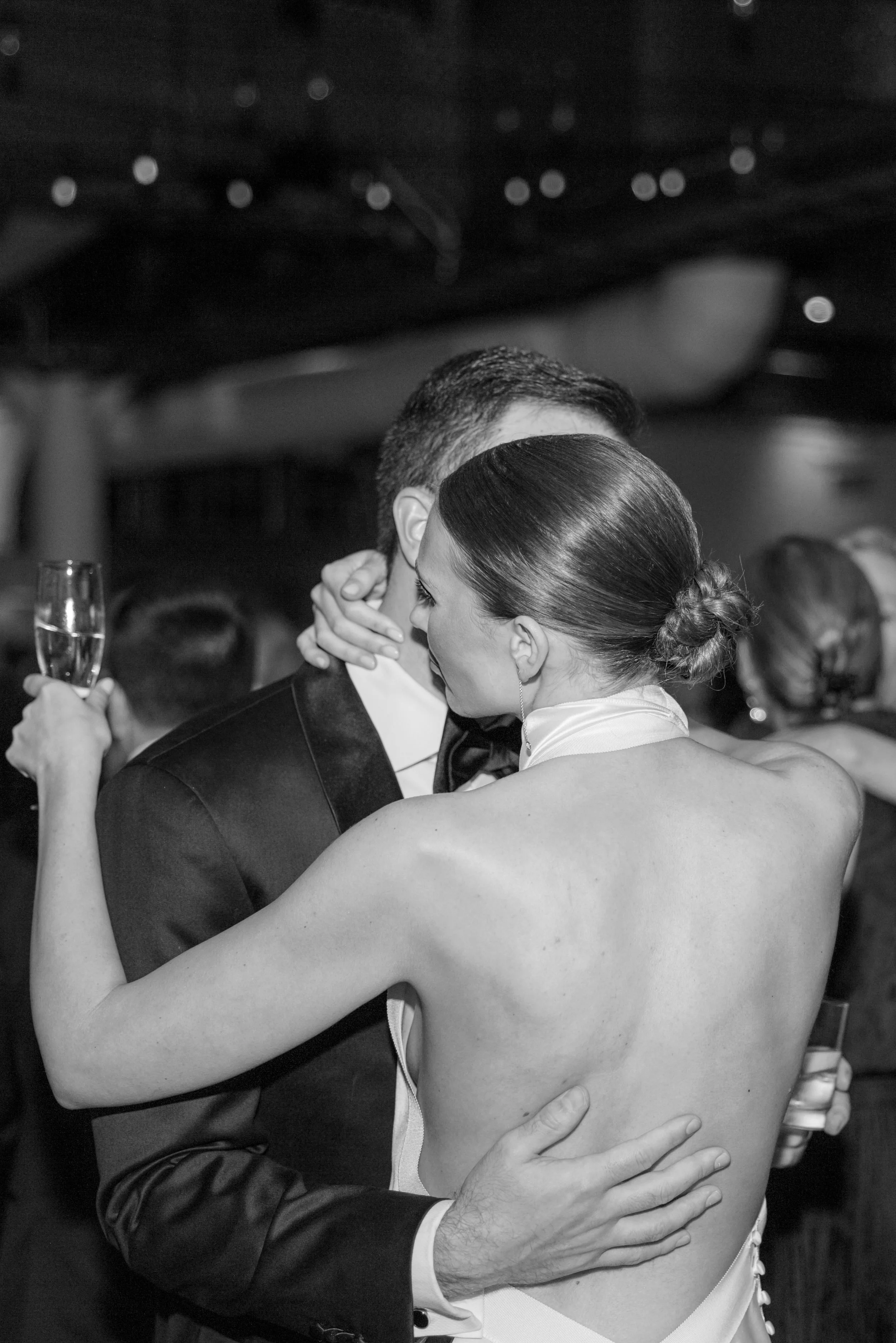 Close moment between bride and groom on the dance floor during their Altman Building reception in Chelsea NYC.