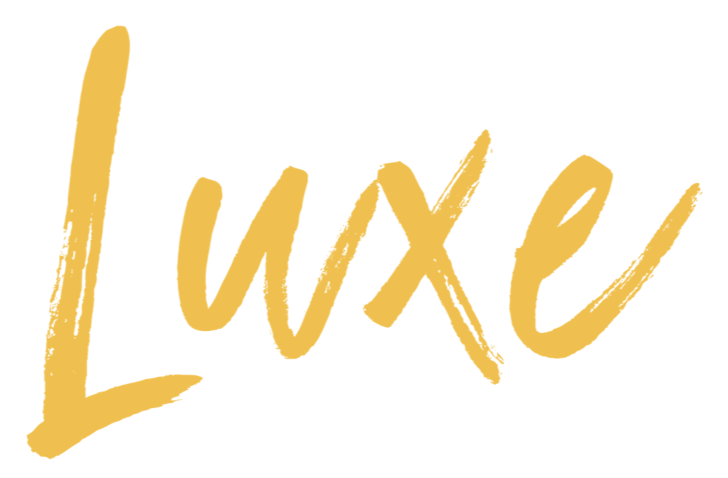 Gold-colored handwritten-style text spelling 'Luxe' on a black background. Tobi Ripley. Roaming bongo drummer. Percussionist. event drummer. wedding entertainment. festival drummer. dj sax percussion. drum player