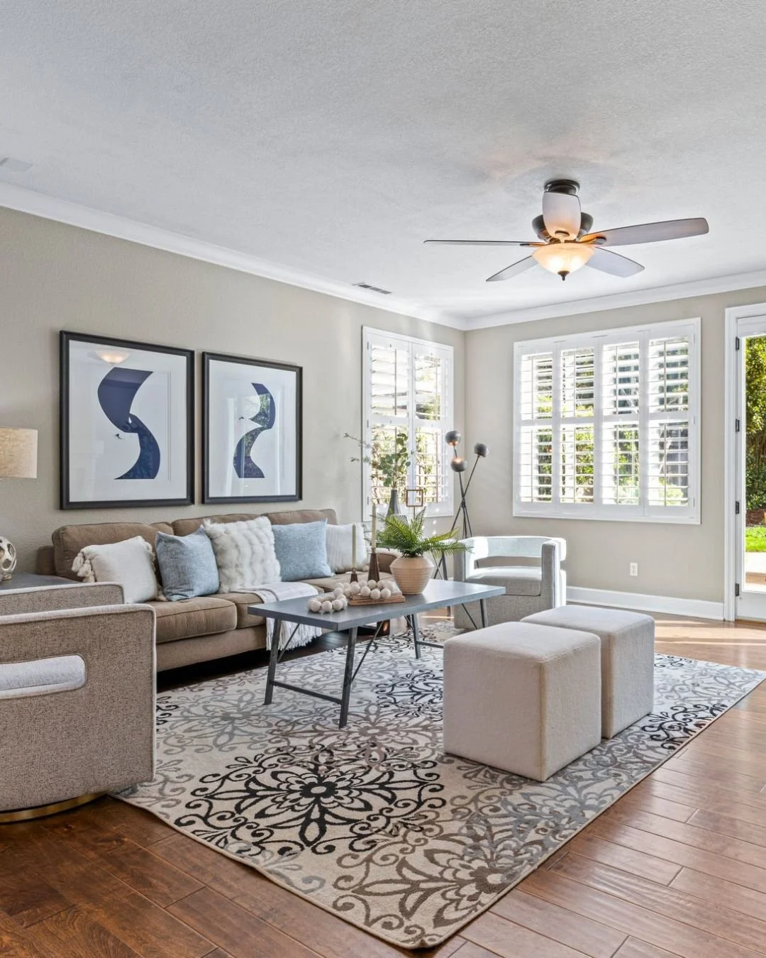 Bright living room with wood floors, modern furnishings, and natural light in a El Dorado Hills, California home.