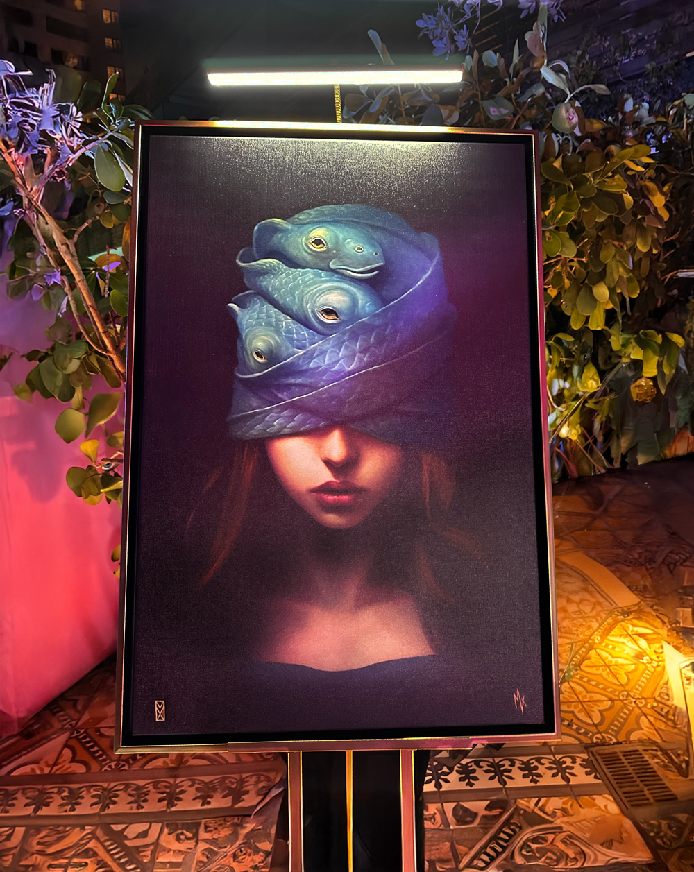 MADX Justice of the Deep fine art canvas print displayed poolside at Art Basel Miami x Nolcha Shows at SLS Hotel. Surreal figurative artwork by NYC artist MADX exhibited in luxury Miami setting.