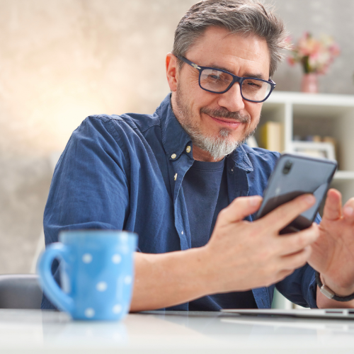 Man using phone to learn