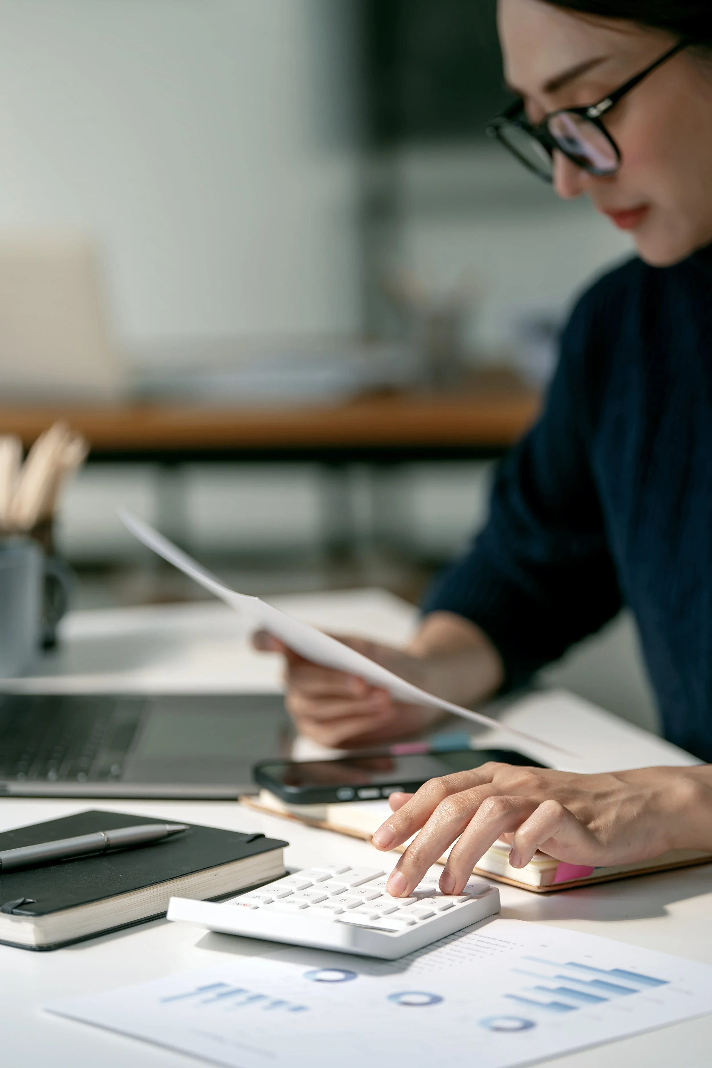 Business owner reviewing financial documents and tax records with a Toronto CPA firm year-round