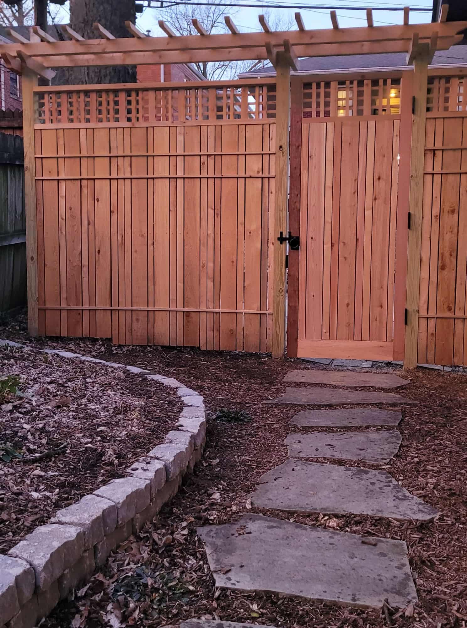 garden gate with lattice and arbor