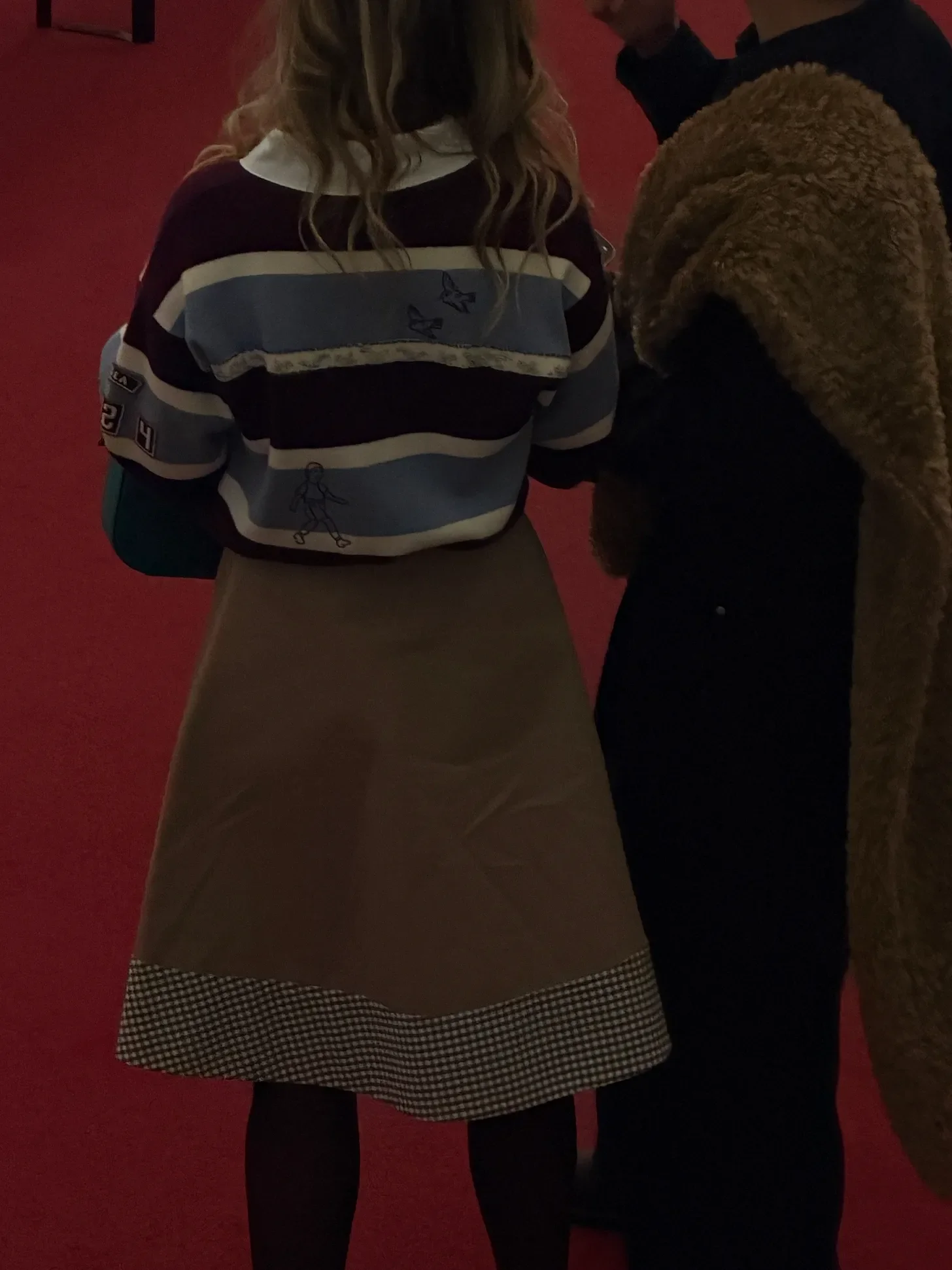 Slight doodling on the sweater.