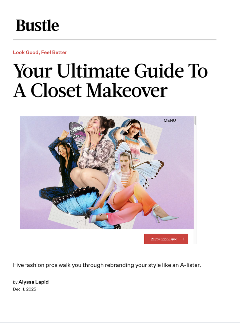 A woman with shoulder-length brown hair standing on a city sidewalk at night, wearing a black leather jacket, a long black coat, and baggy blue jeans with patches. She is looking to her right and appears to be speaking or gesturing with her hand.