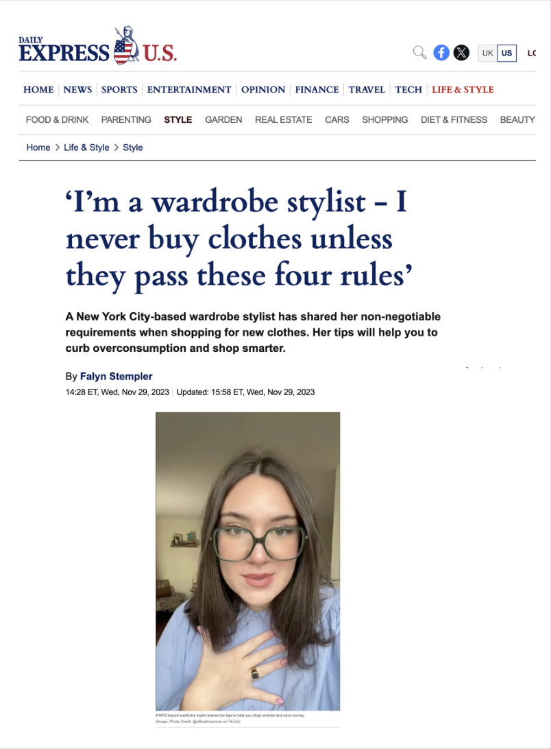 A woman lying on her back on a floral-patterned couch with a pink pillow behind her head, wearing glasses and a black top, making a facial expression.